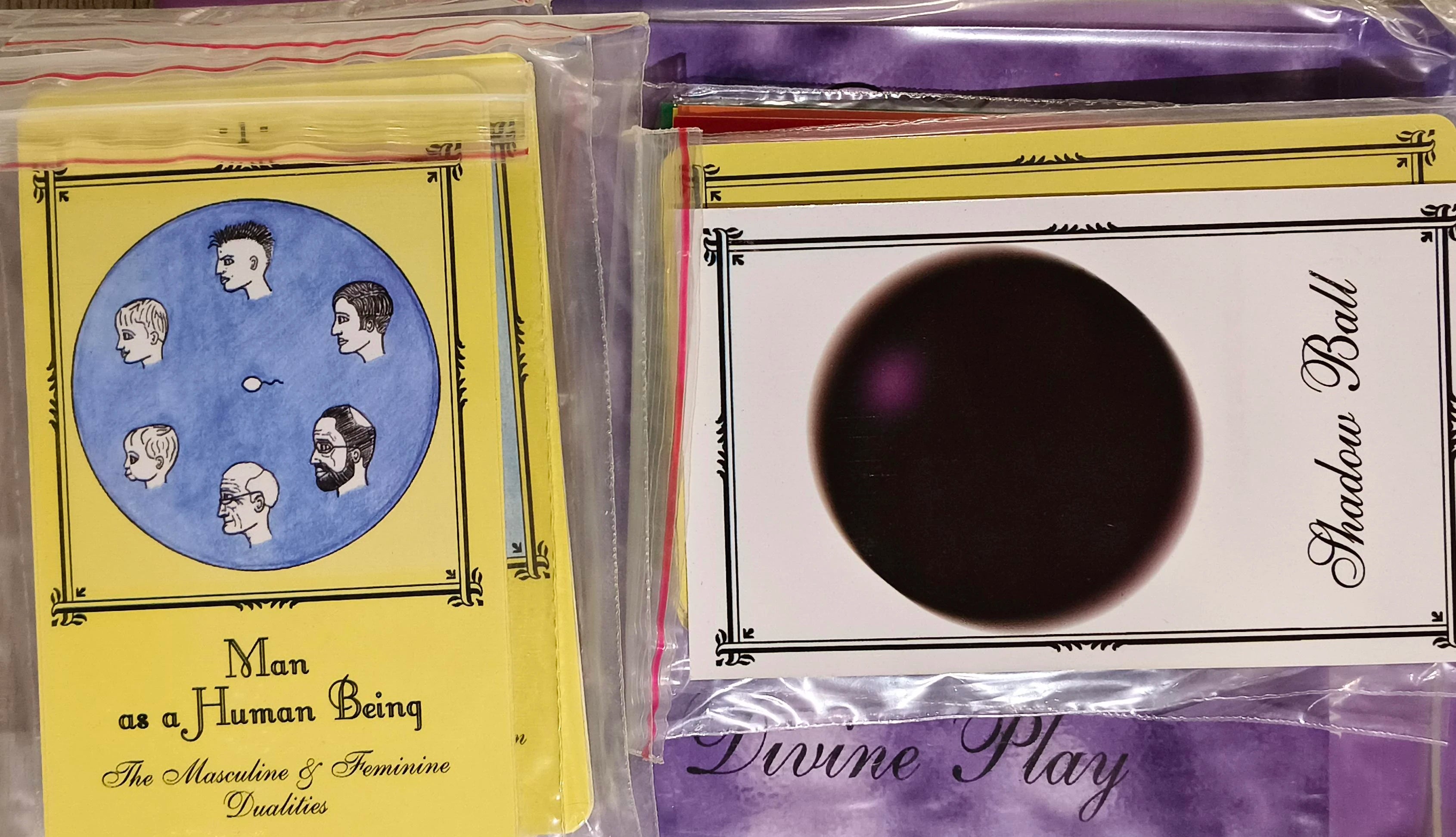 Set of spiritual game cards including 'Man as a Human Being' and 'Shadow Ball' cards