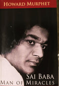 Paperback book titled 'Sai Baba Man of Miracles' by Howard Murphet with close-up portrait