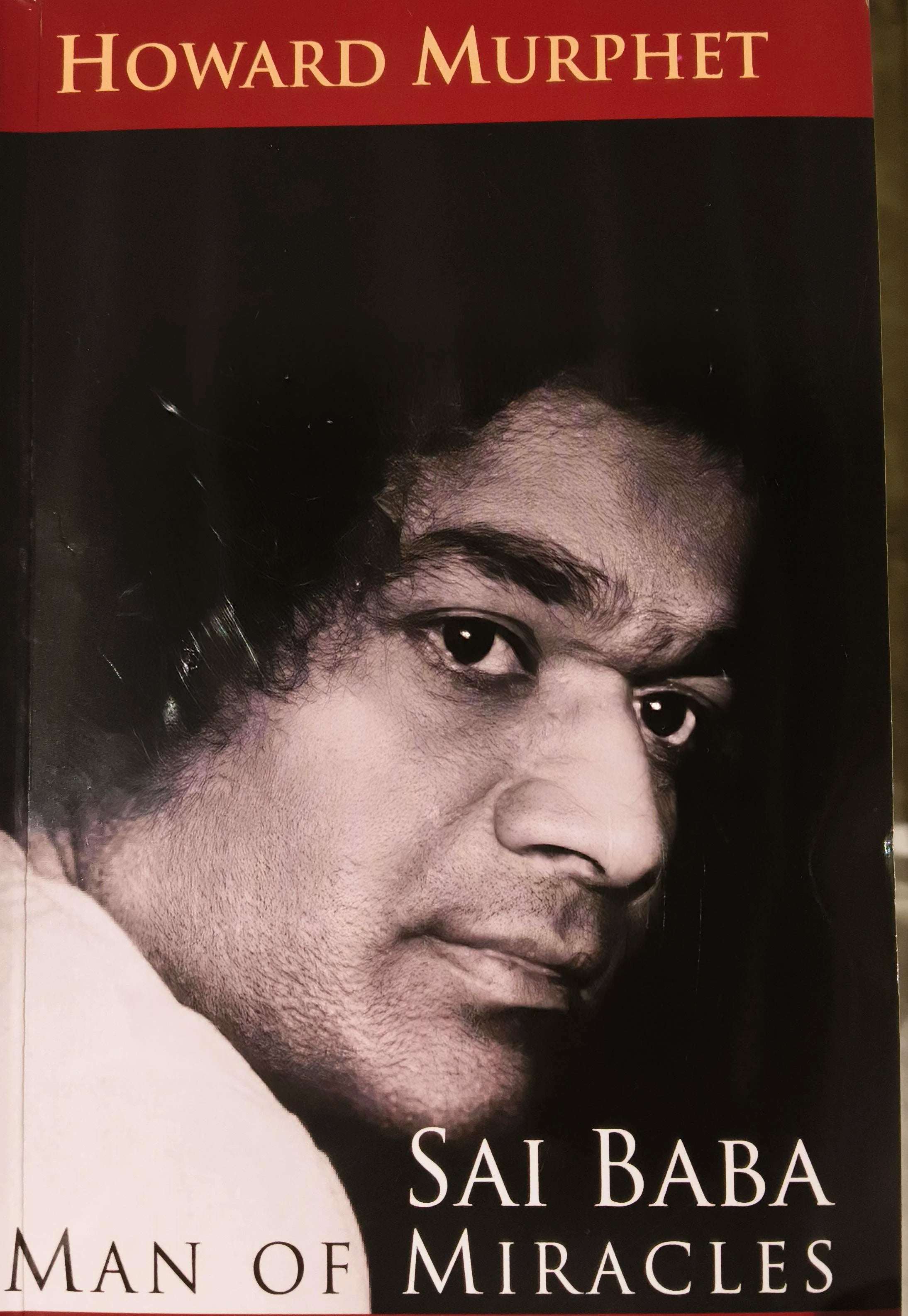 Paperback book titled 'Sai Baba Man of Miracles' by Howard Murphet with close-up portrait