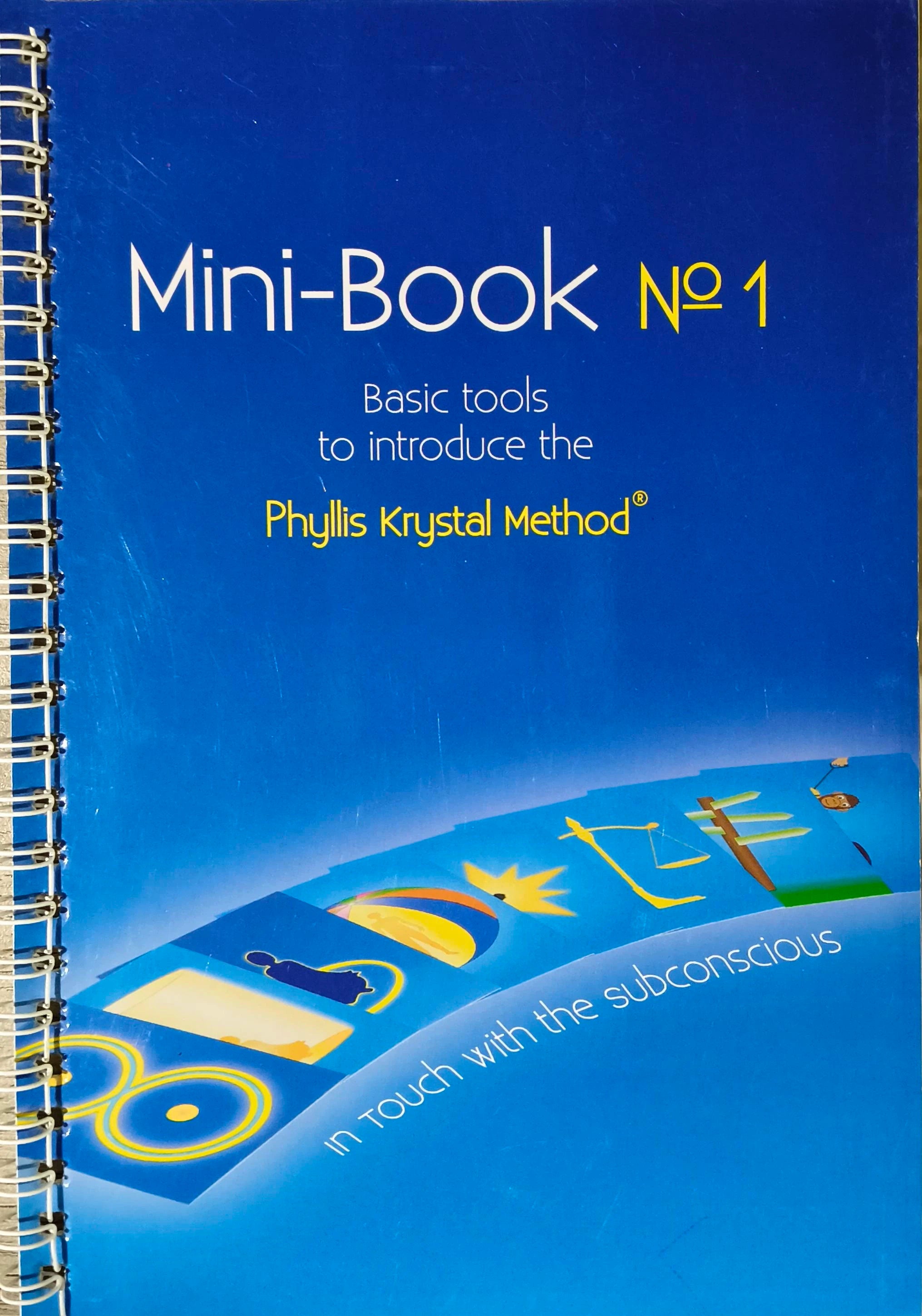 Spiral-bound Mini-Book No 1 by Phyllis Krystal with blue cover and spiritual symbols