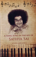 Paperback book titled A Song Sung in the Key of Sathya Sai by John Grimes with portrait and musical theme