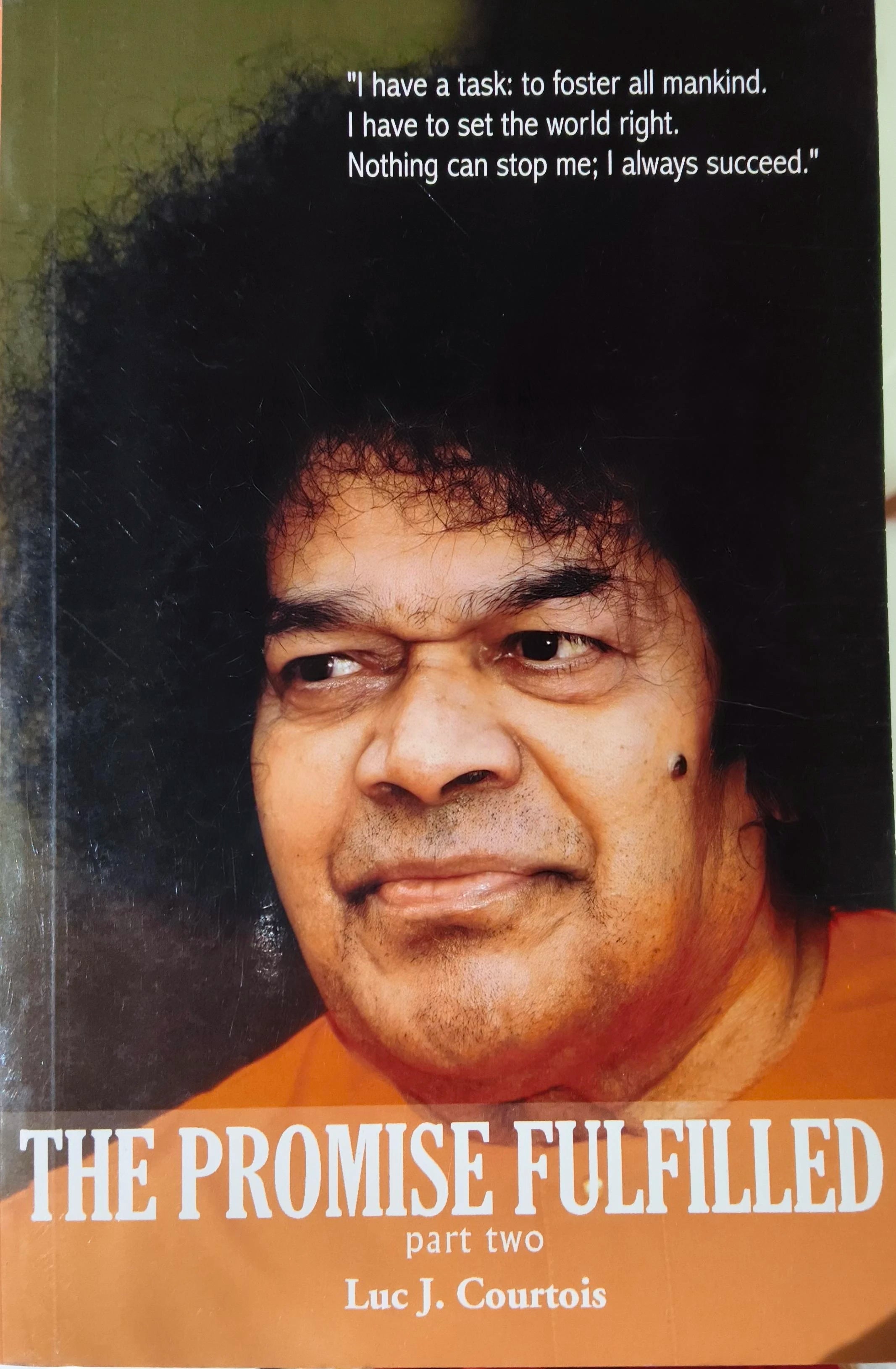 Paperback book titled The Promise Fulfilled Part Two by Luc J. Courtois with close-up photo of a man on cover