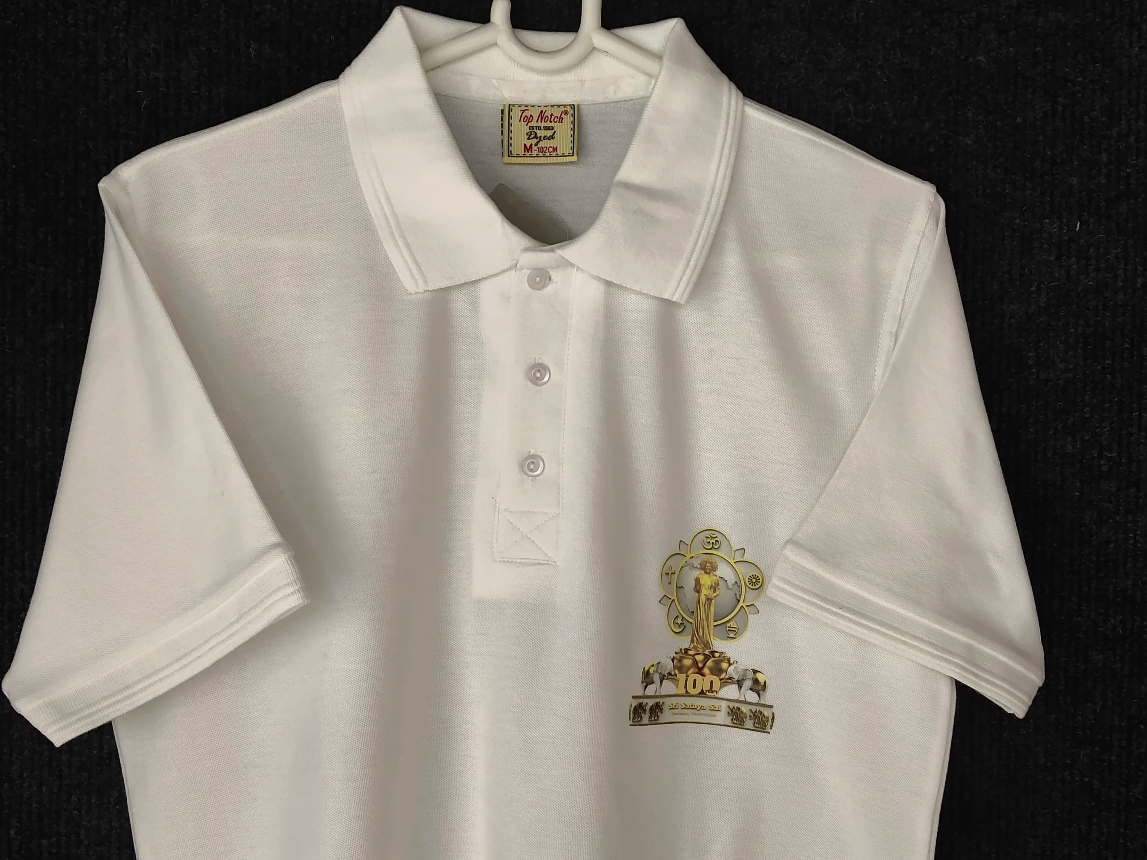 White men's polo T-shirt with Sai Baba centenary emblem on front