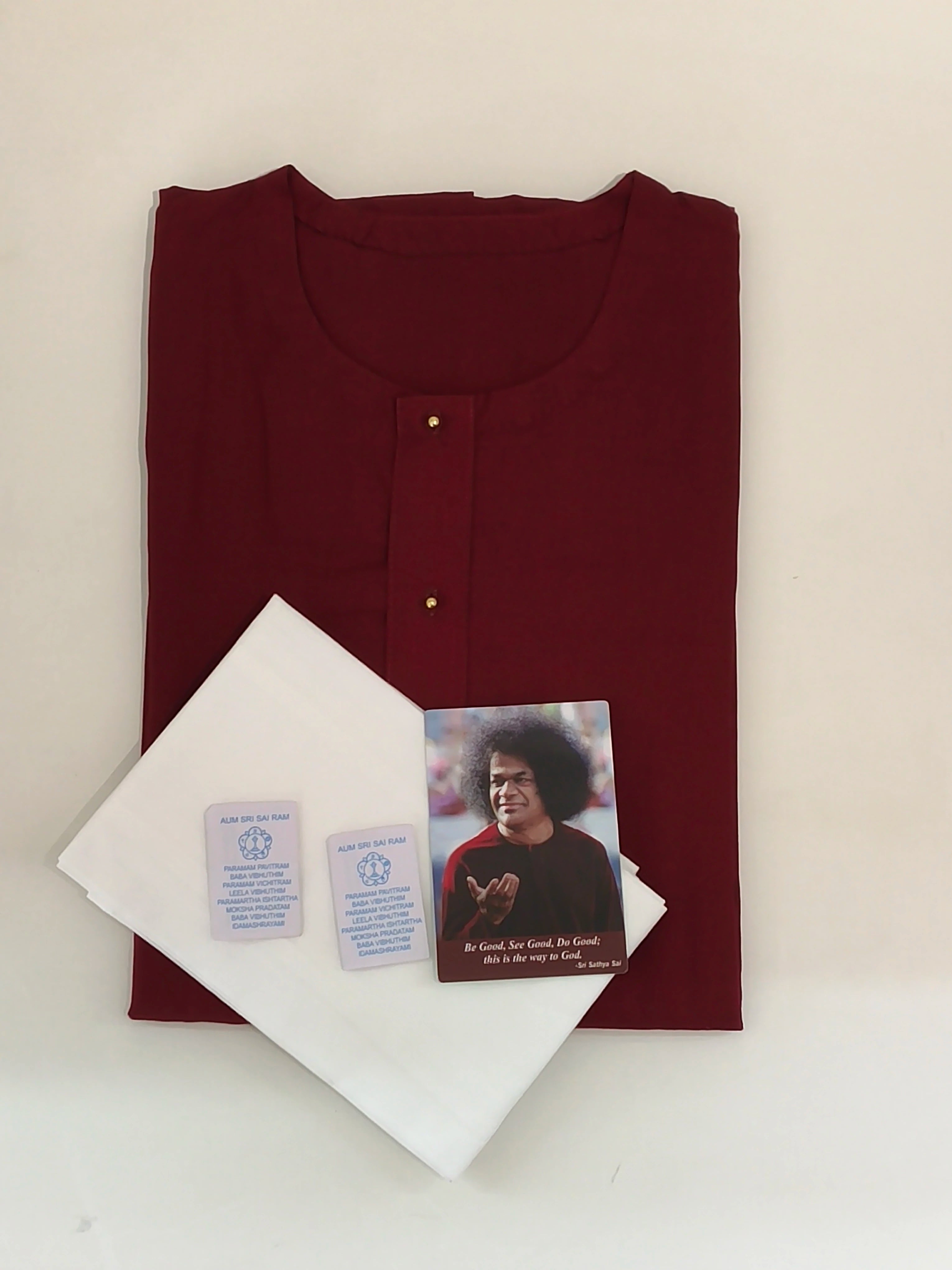 Folded maroon Swamy robe with white napkins and vibhuthi packets