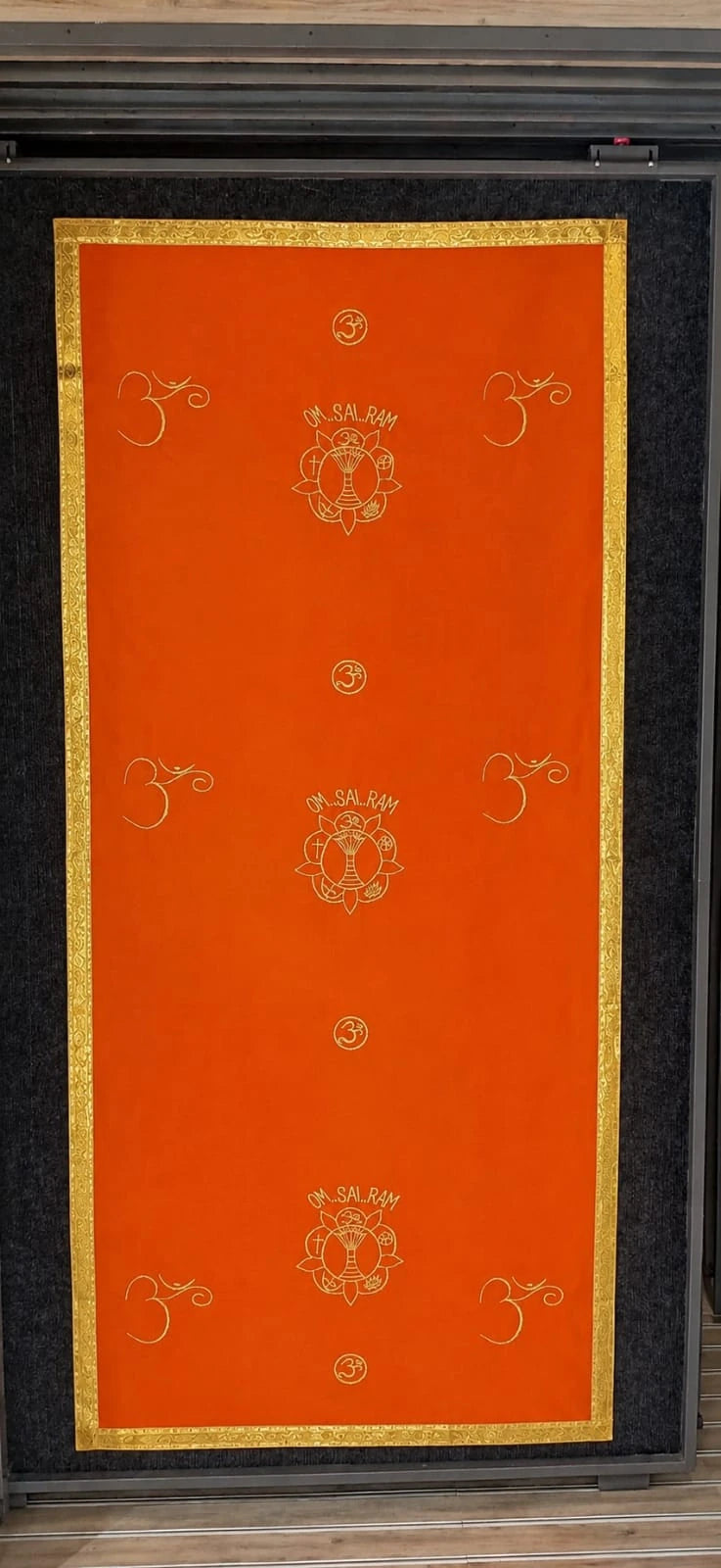 Large orange pooja table cloth with golden border and spiritual symbols