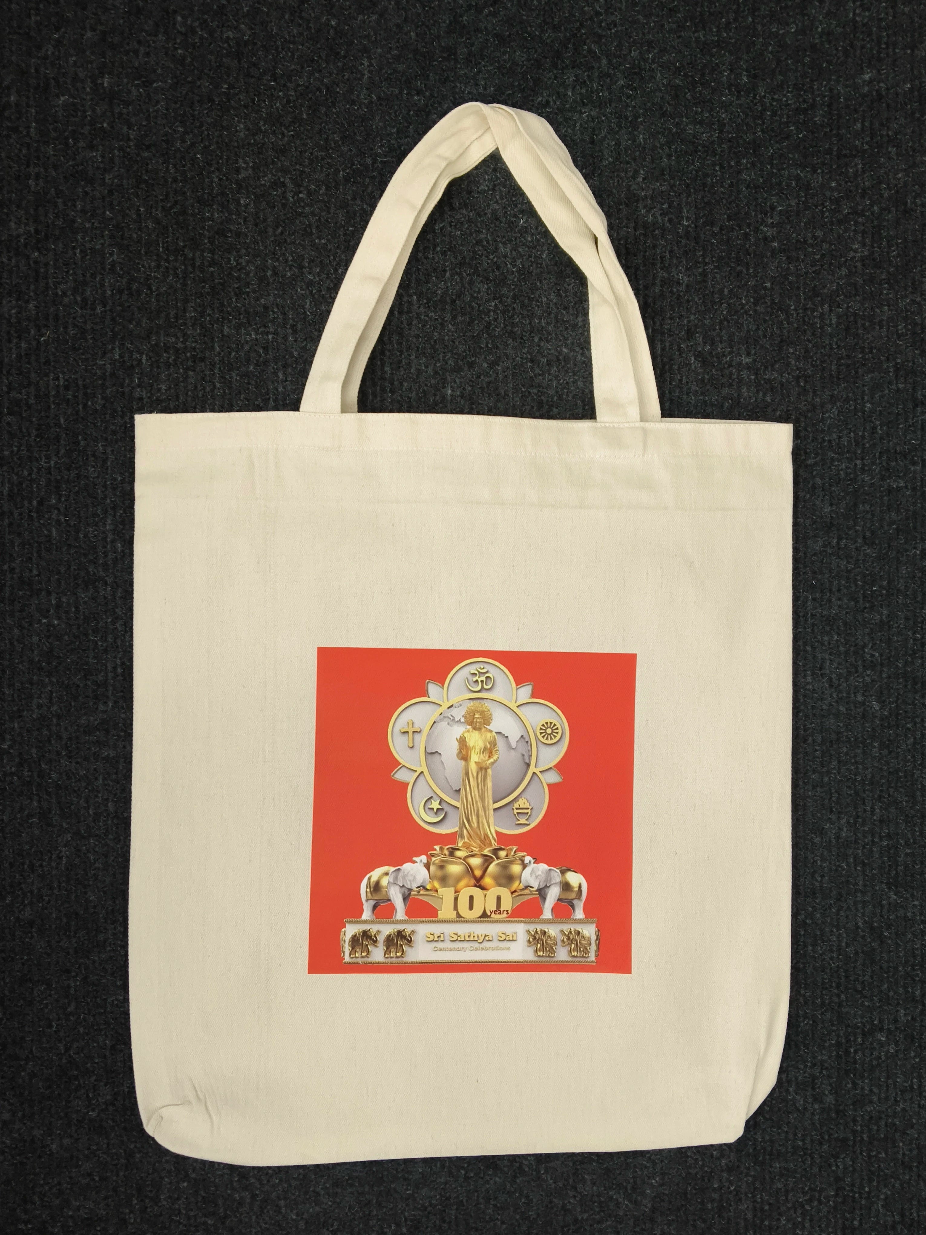 Beige tote bag with colorful Hundred Years logo and spiritual symbols print