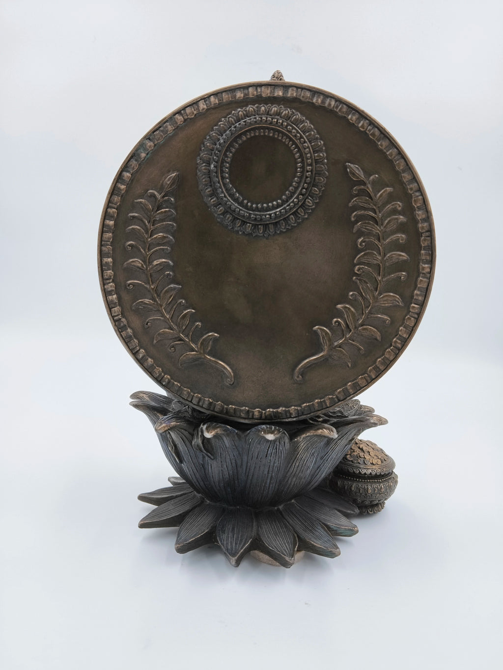 Back view of metallic fiber Lakshmi sculpture on lotus pedestal