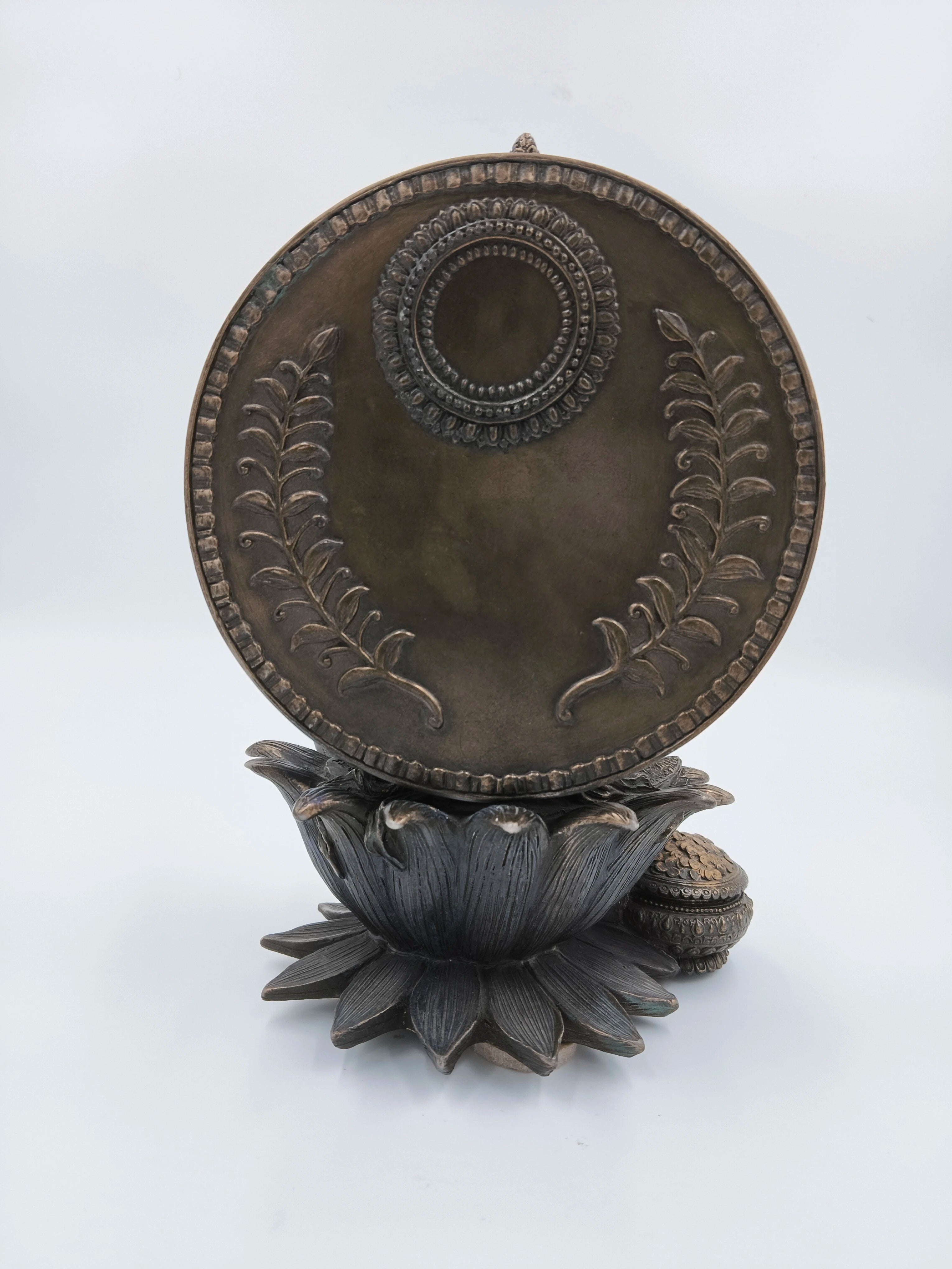 Back view of metallic fiber Lakshmi sculpture on lotus pedestal