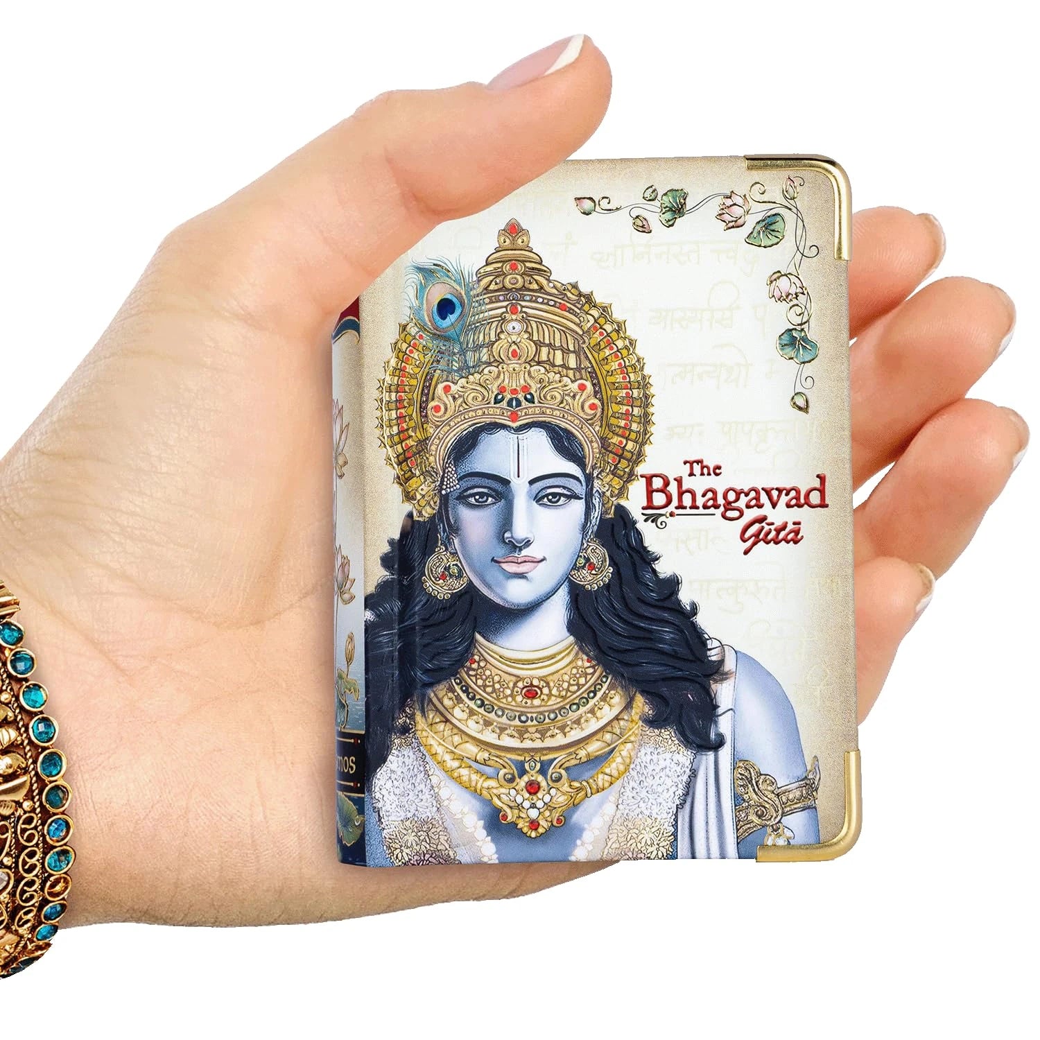 Hand holding The Bhagavad Gita Classic Edition A7 English hardbound book with Krishna illustration