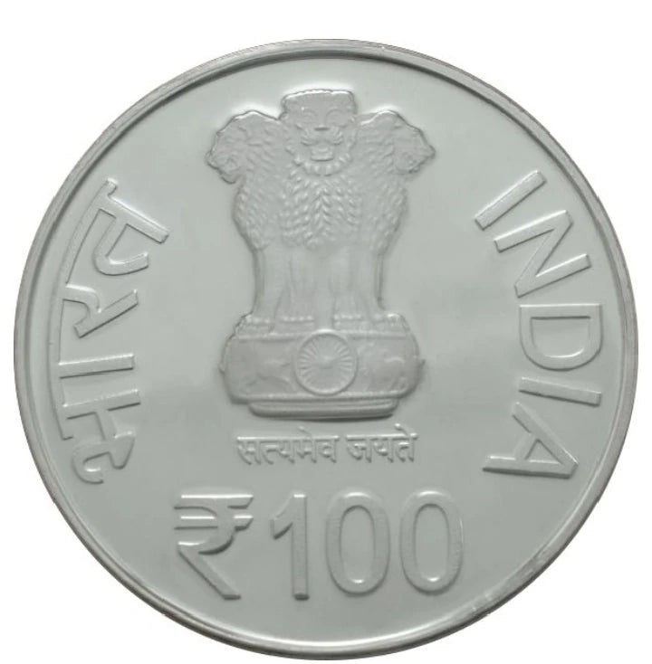 Front view of compact commemorative coin featuring Indian national emblem and 100 rupees denomination
