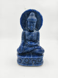Front view of a blue jade Buddha statue seated with decorative base