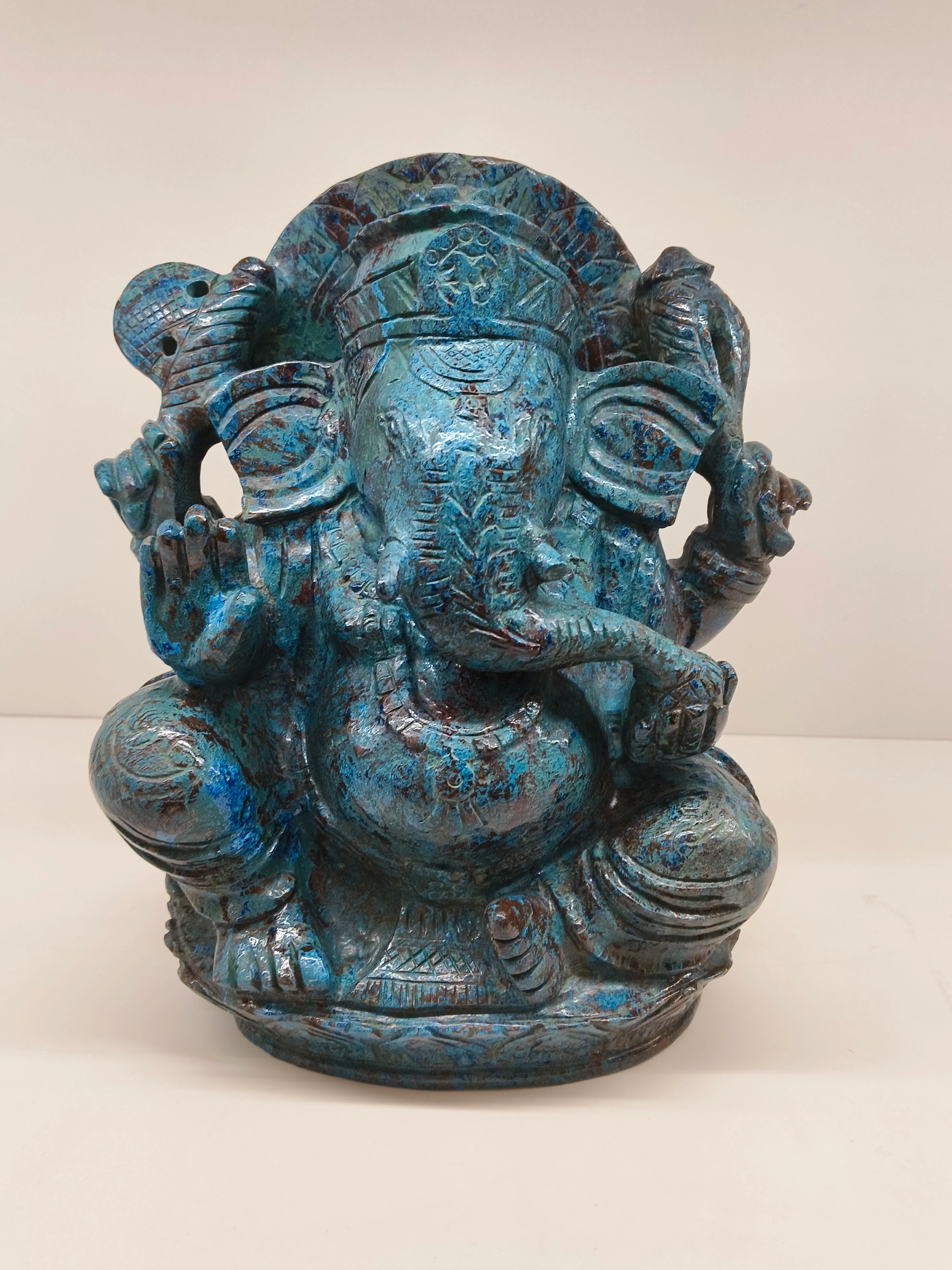 Large blue-green Chrysocolla sculpture of Lord Ganesh seated with detailed carvings