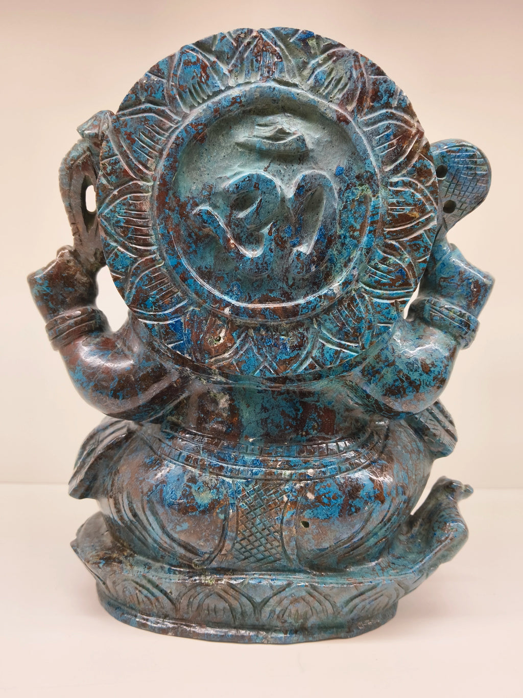 Back view of large Chrysocolla Ganesh sculpture with Om symbol and intricate detailing