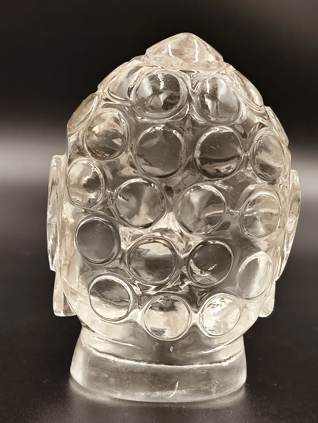 Clear crystal Buddha head idol sculpture with textured spherical curls