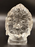 Clear crystal Buddha head idol sculpture with textured spherical curls