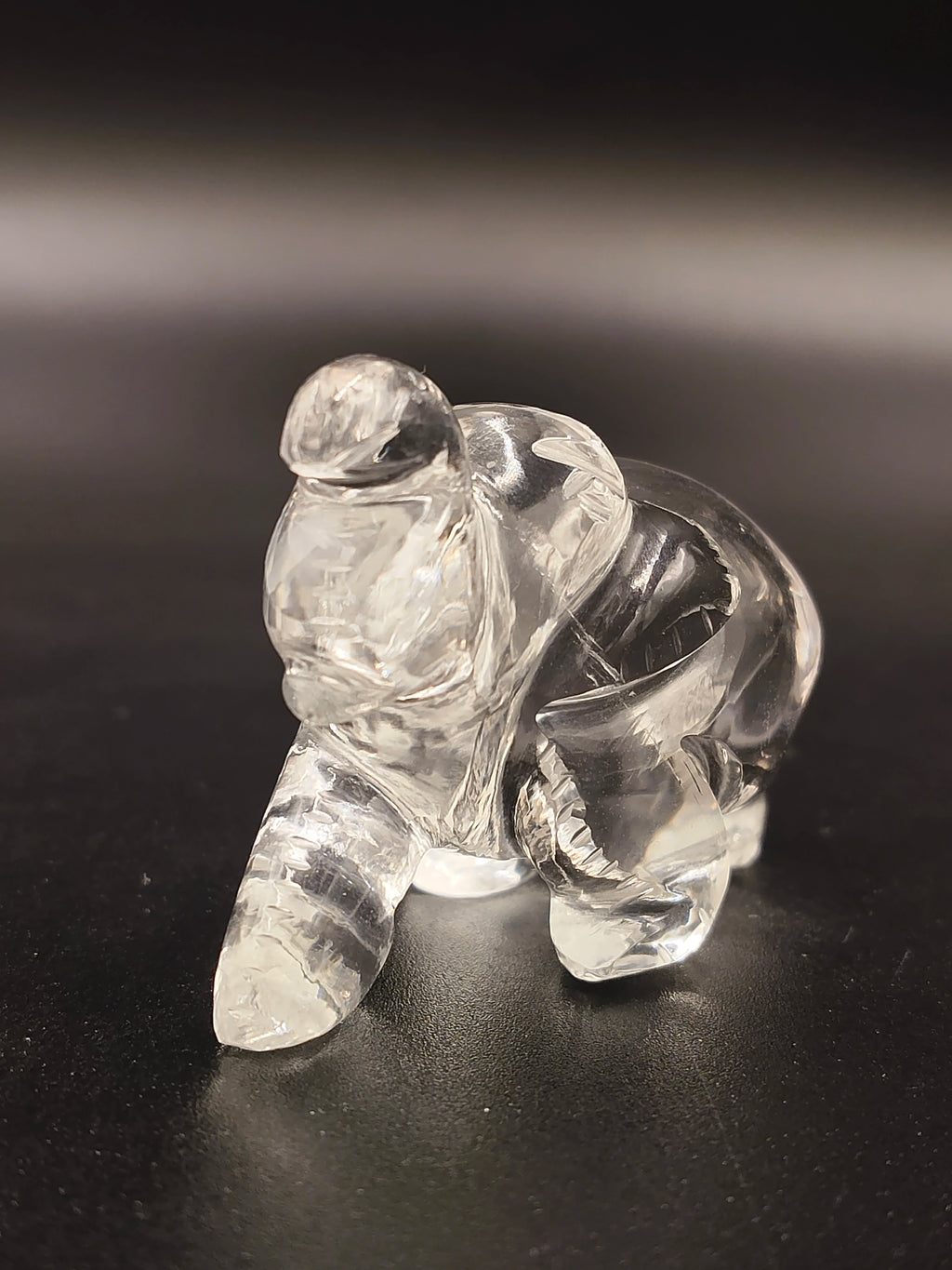 Compact clear crystal elephant figurine sculpture on black surface