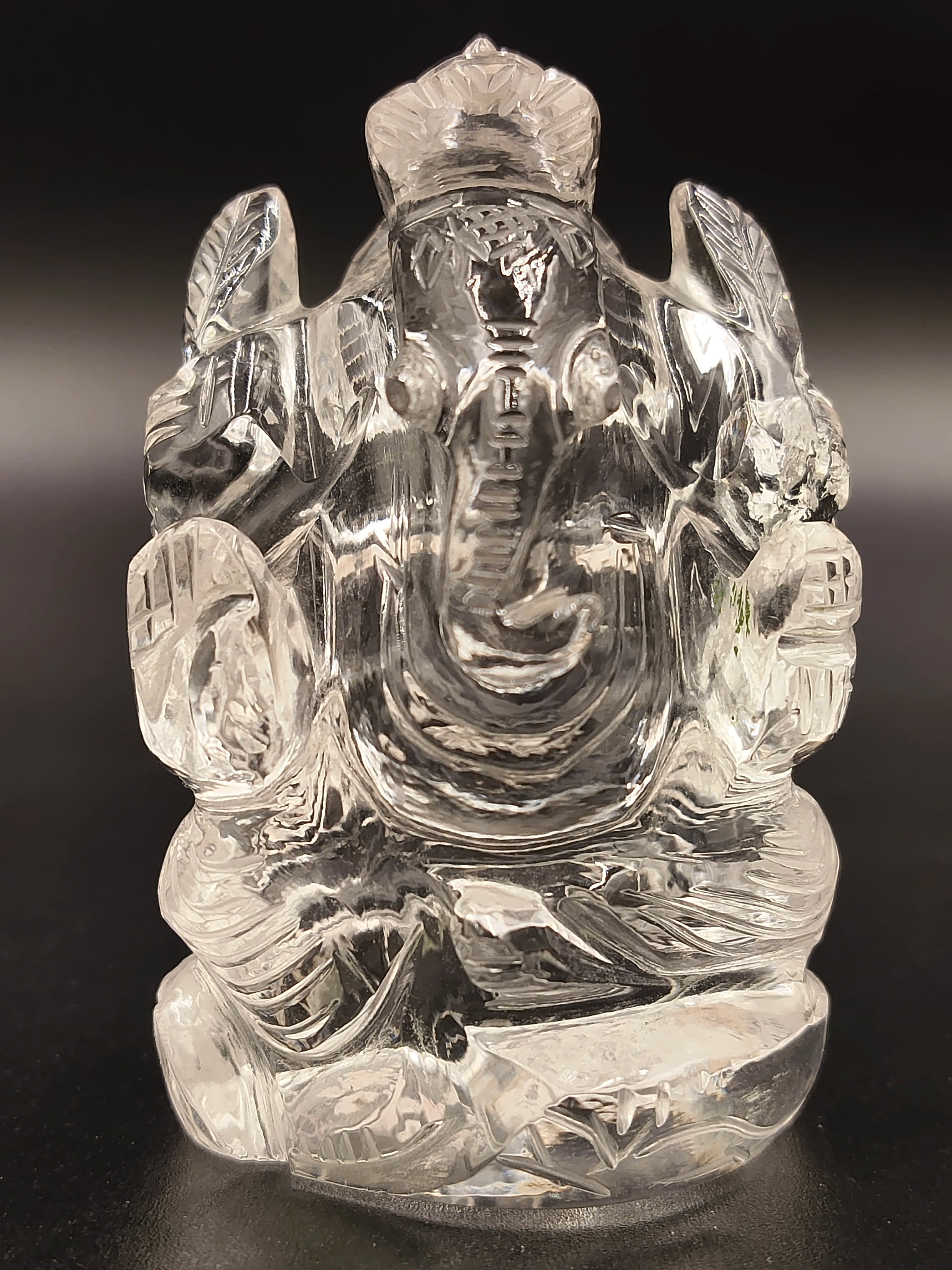 2-inch clear crystal statue of Hindu deity Ganesh sitting with detailed carvings