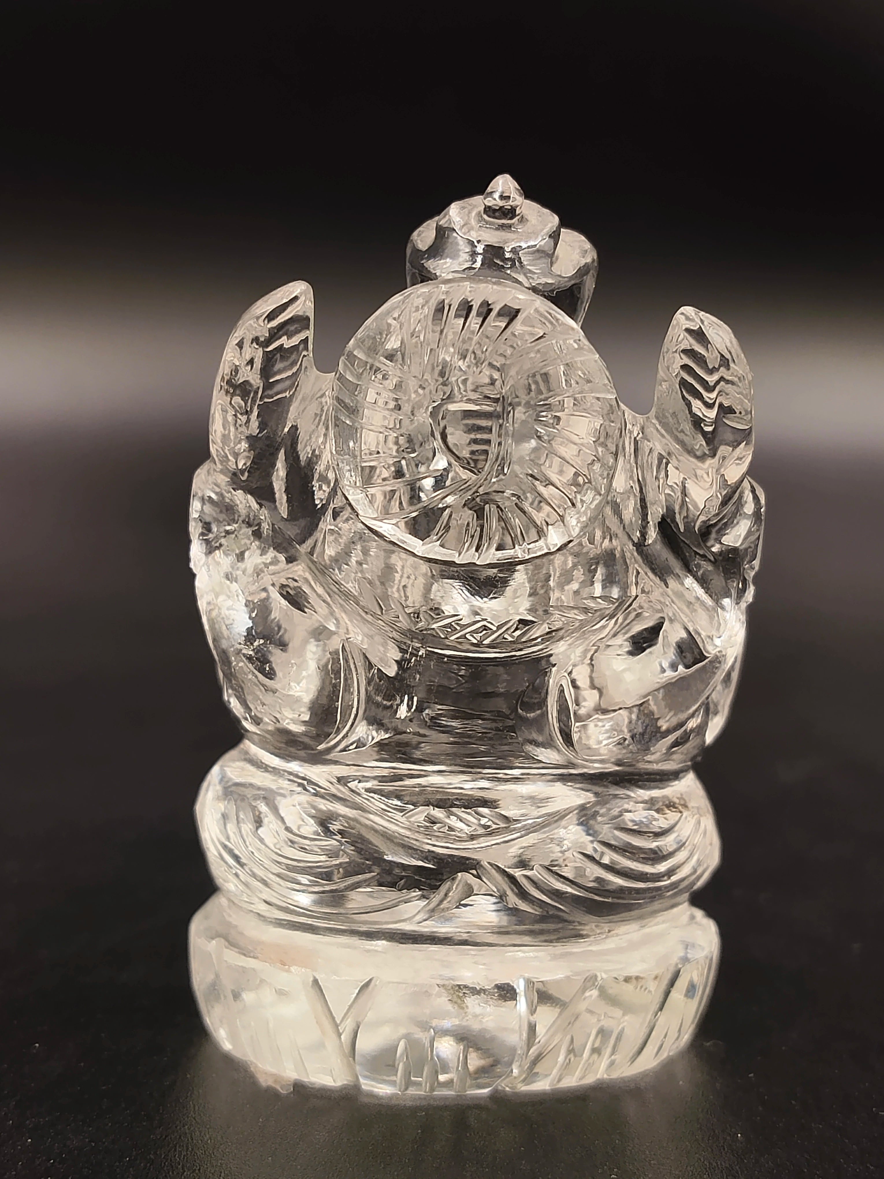 Clear crystal miniature Ganesh statue sitting cross-legged front view
