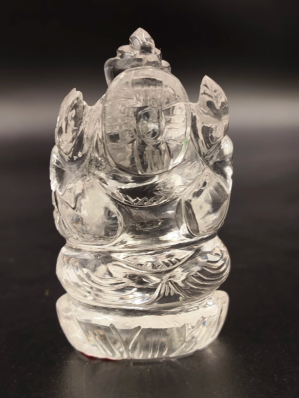 Small crystal sculpture of Ganesh deity carved with intricate details