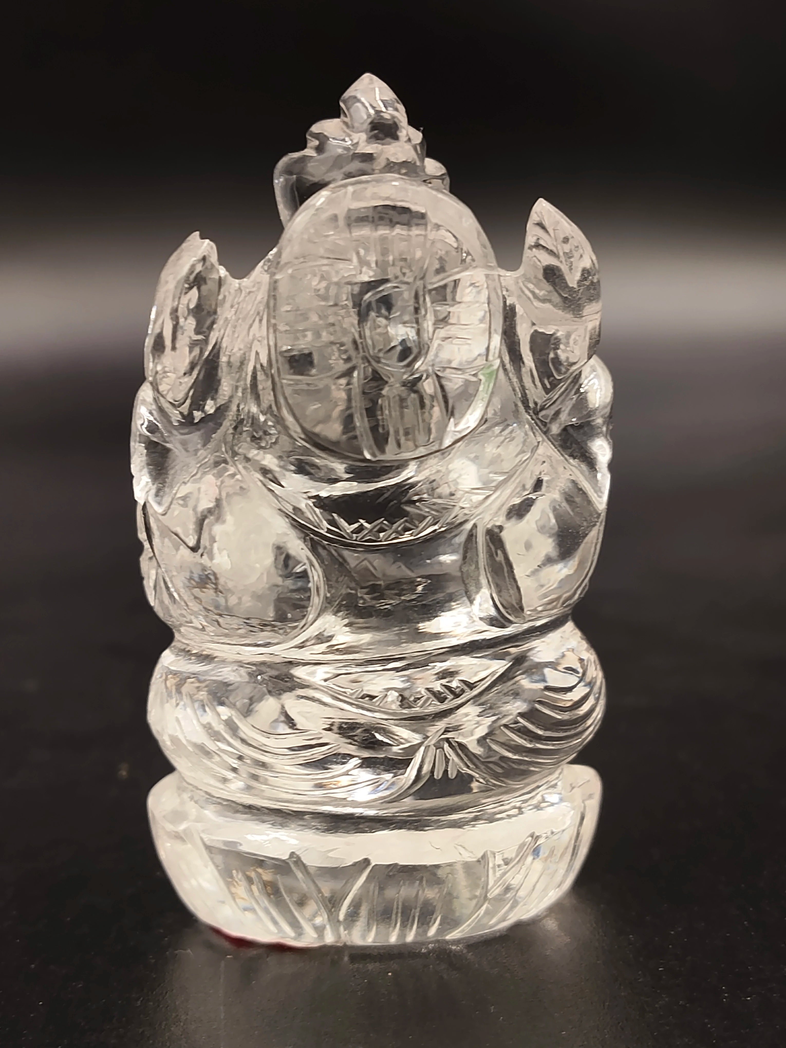 Small crystal sculpture of Ganesh deity carved with intricate details