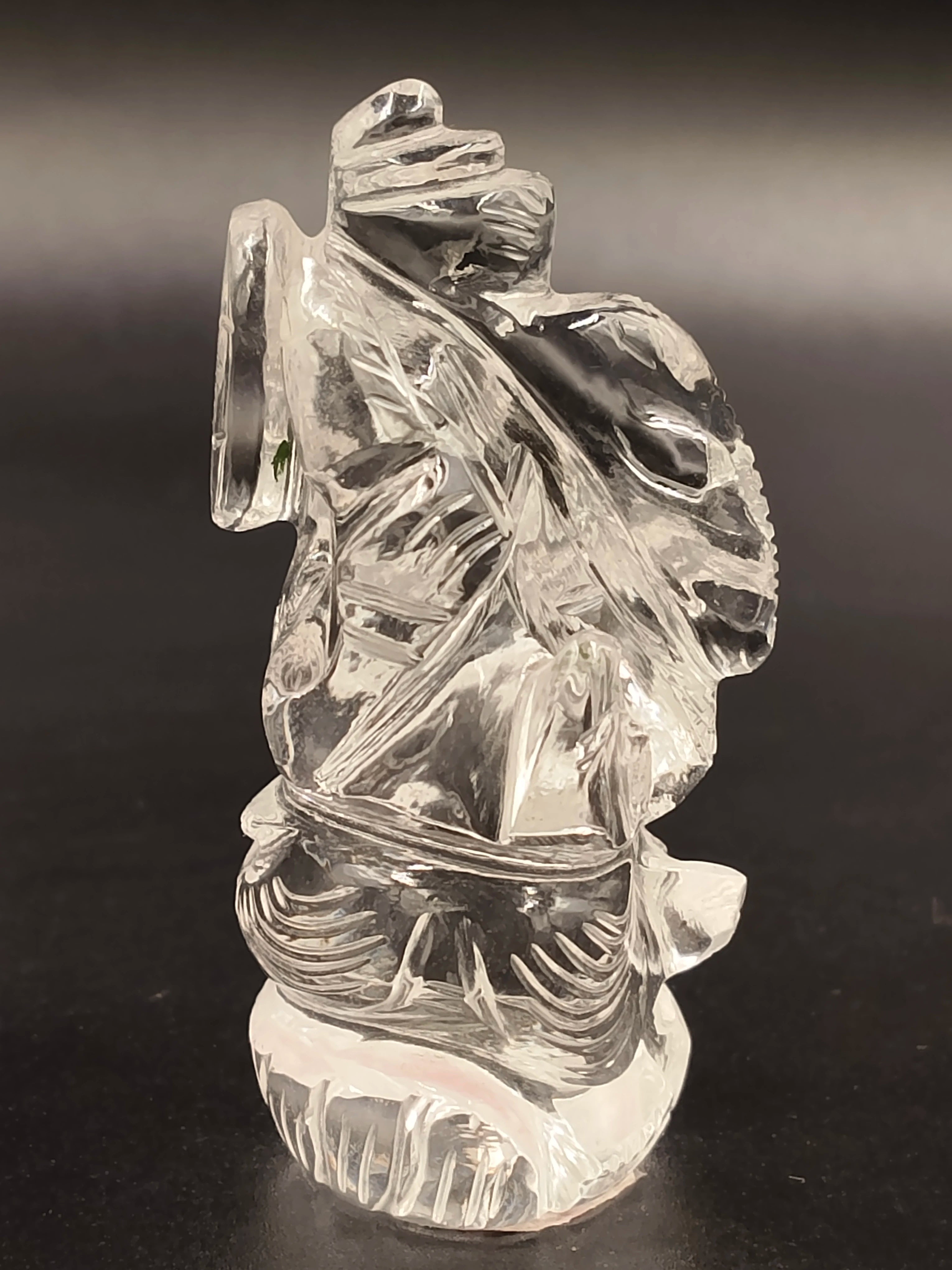 Miniature clear crystal sculpture of Ganesh deity with intricate carvings