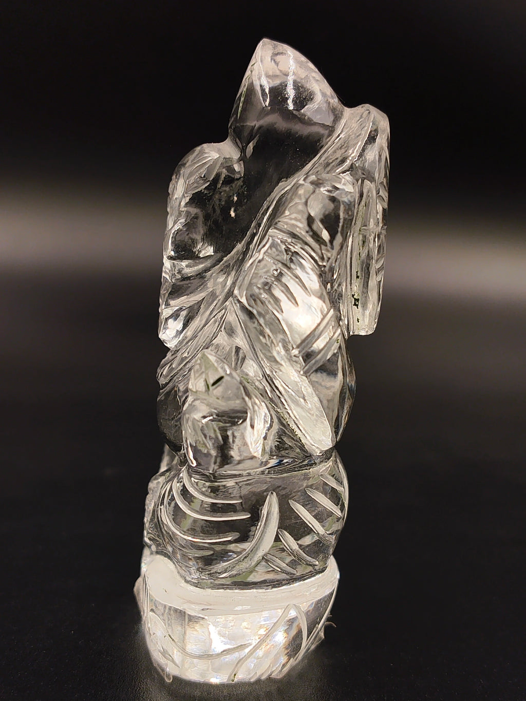 Mini crystal sculpture of Ganesh deity with intricate carvings side view