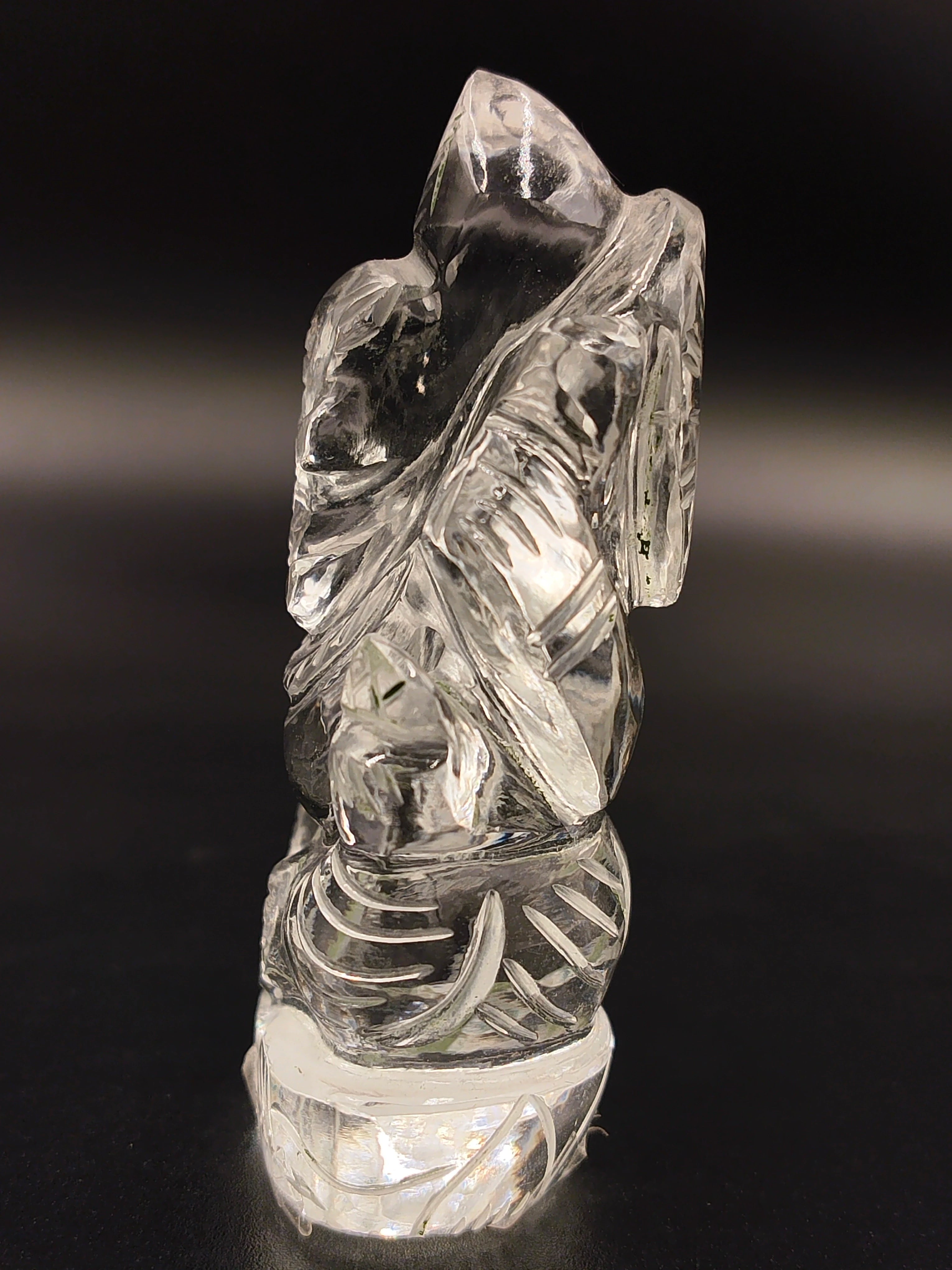 Mini crystal sculpture of Ganesh deity with intricate carvings side view