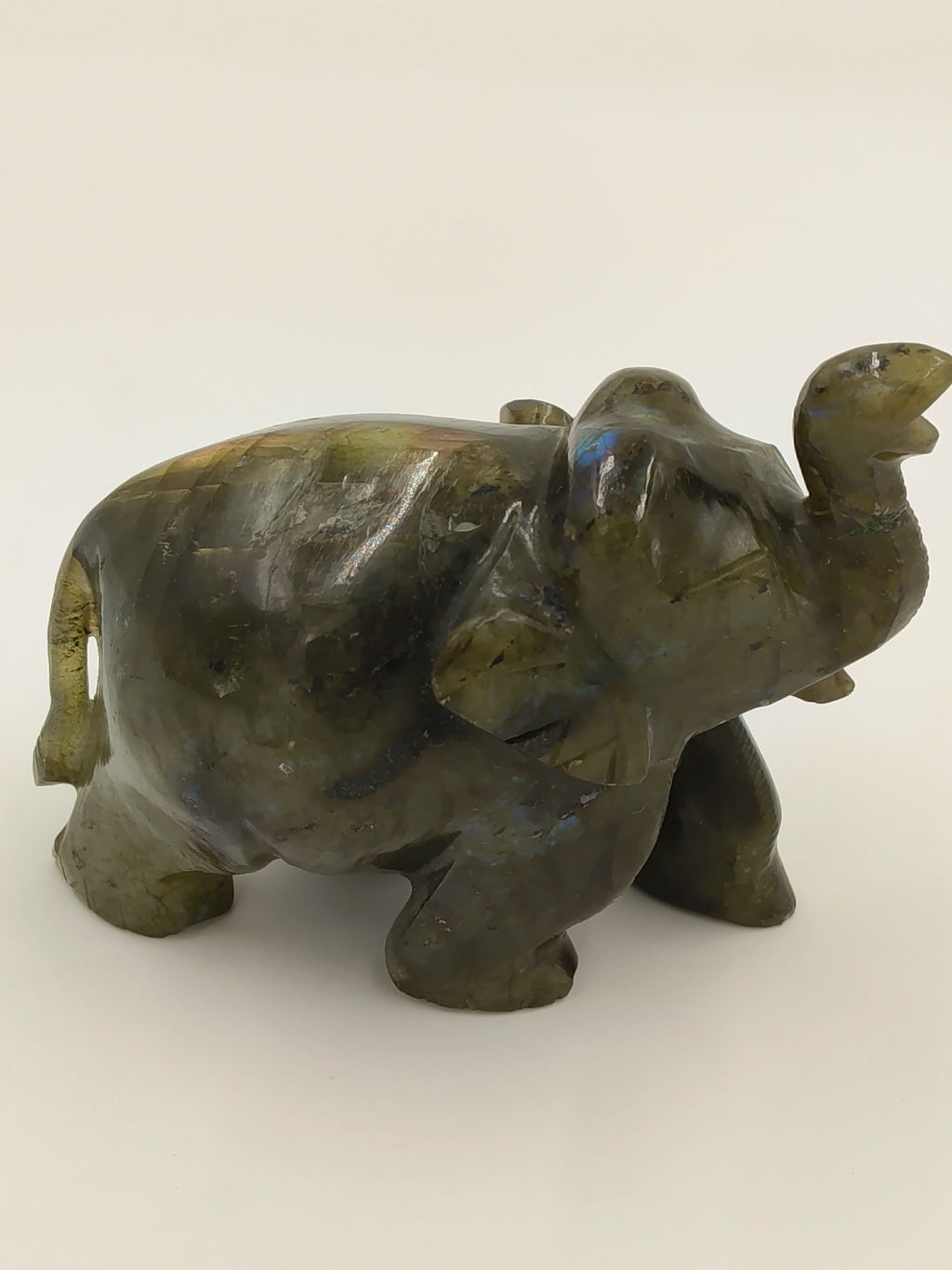 Small labradorite elephant sculpture with raised trunk tabletop decor