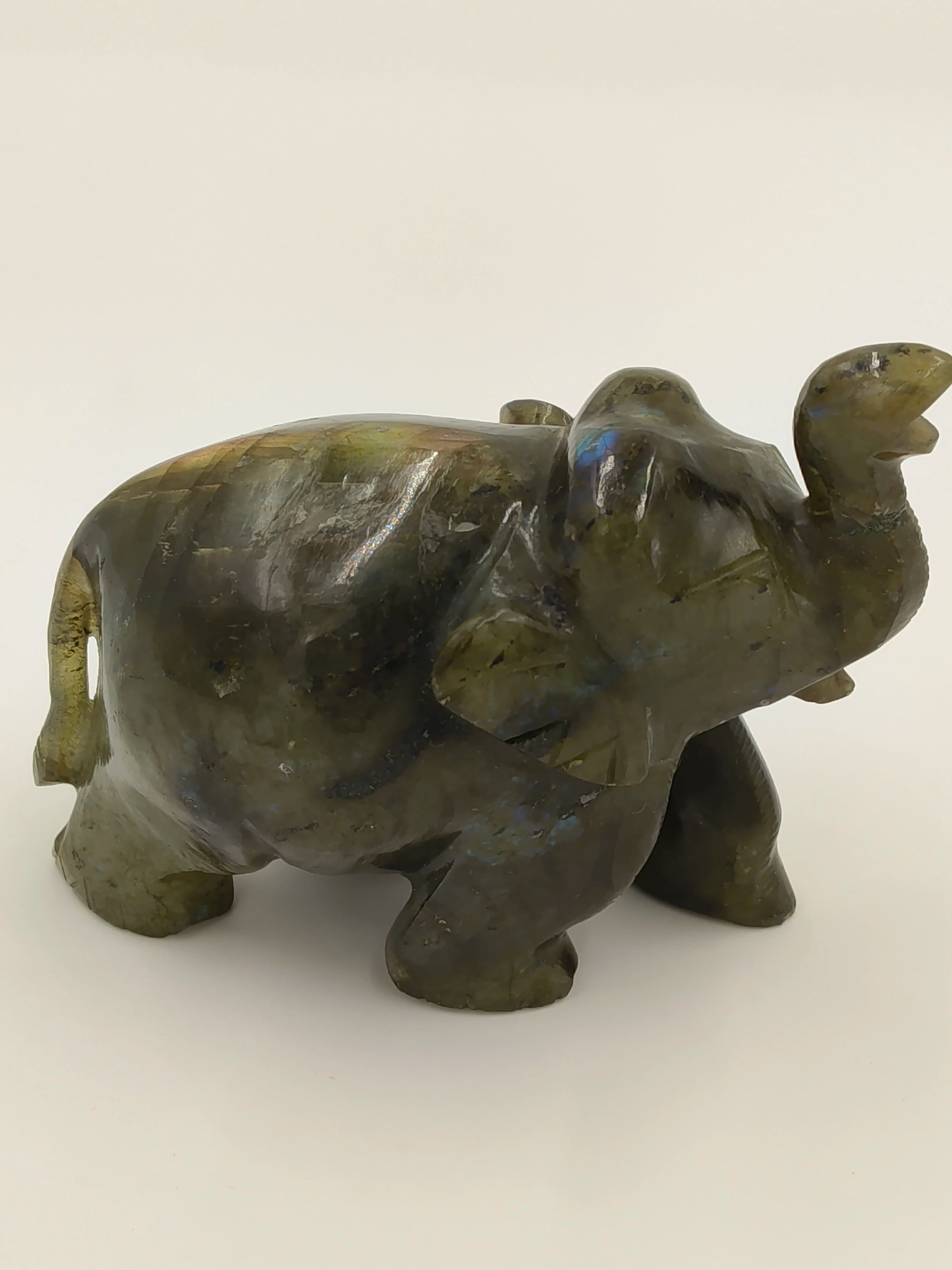 Small labradorite elephant sculpture with raised trunk tabletop decor