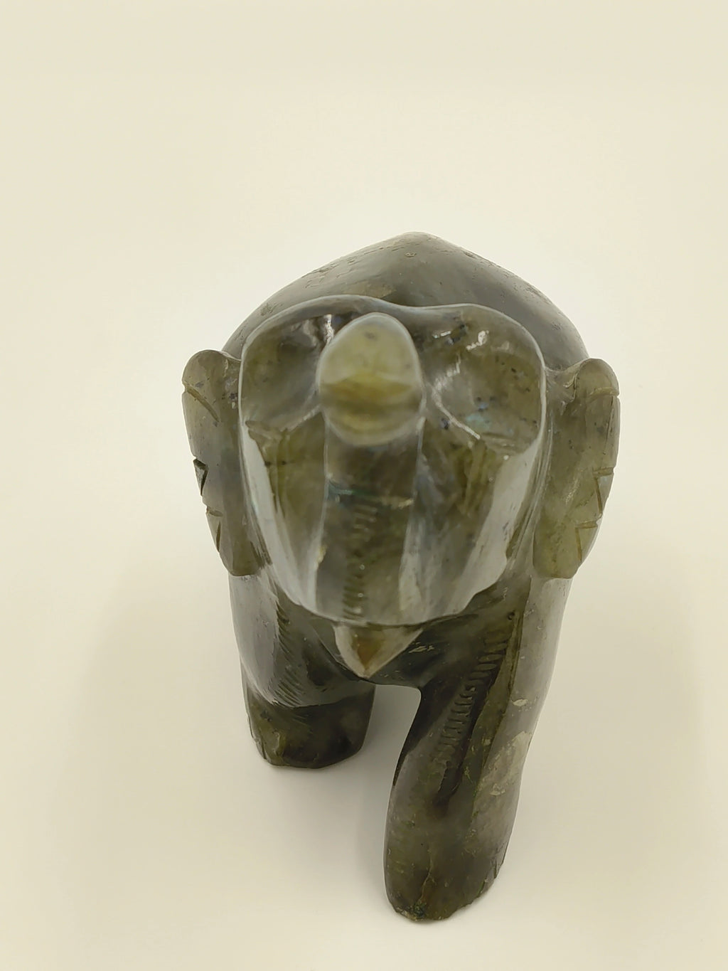 Front view of small labradorite elephant sculpture for tabletop decor