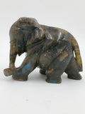 Small labradorite elephant sculpture with iridescent blue and green hues
