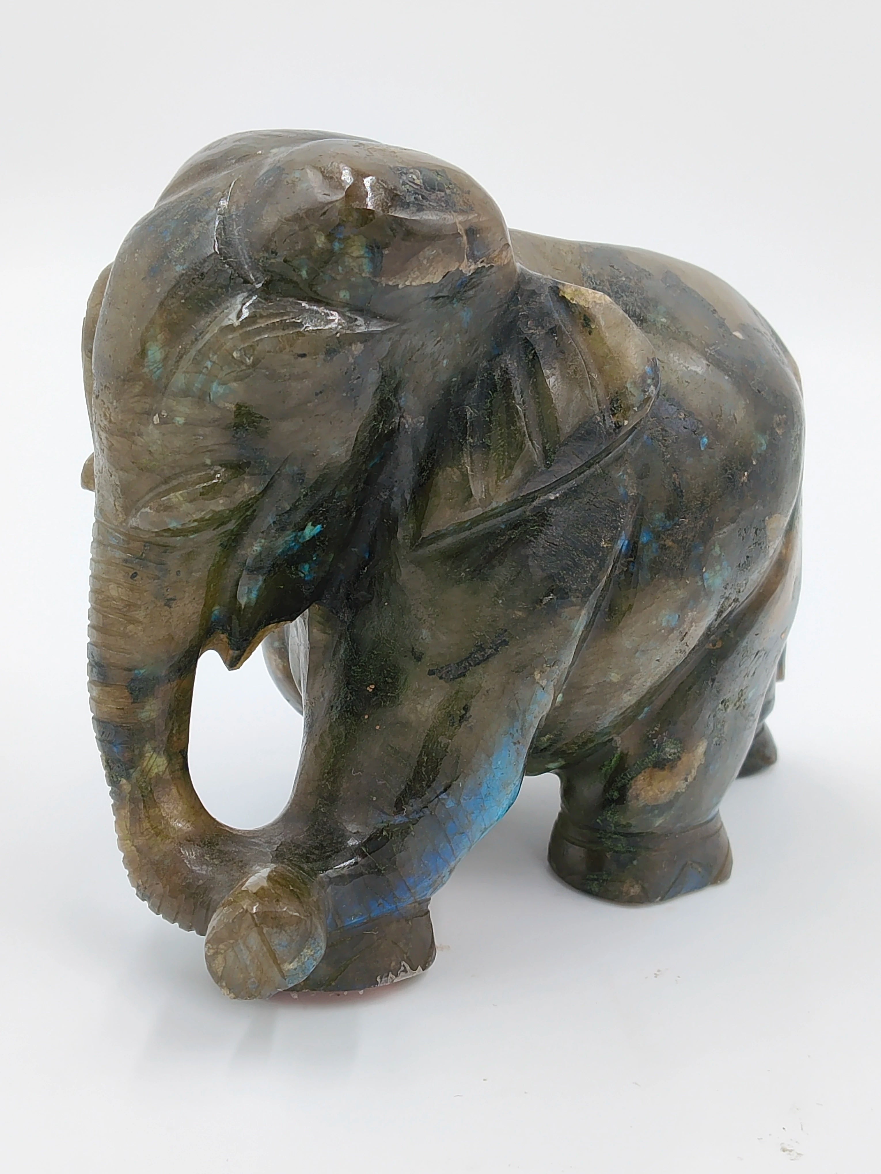 Small labradorite elephant figurine sculpture with blue and green hues