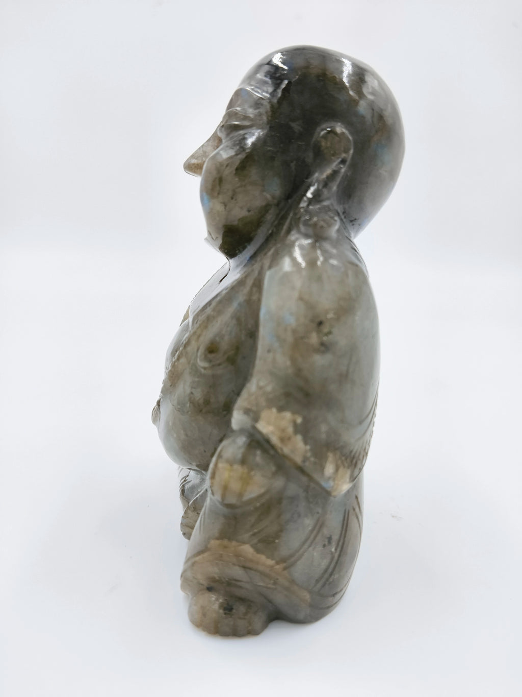 Side view of a 3.9-inch labradorite Laughing Buddha sculpture
