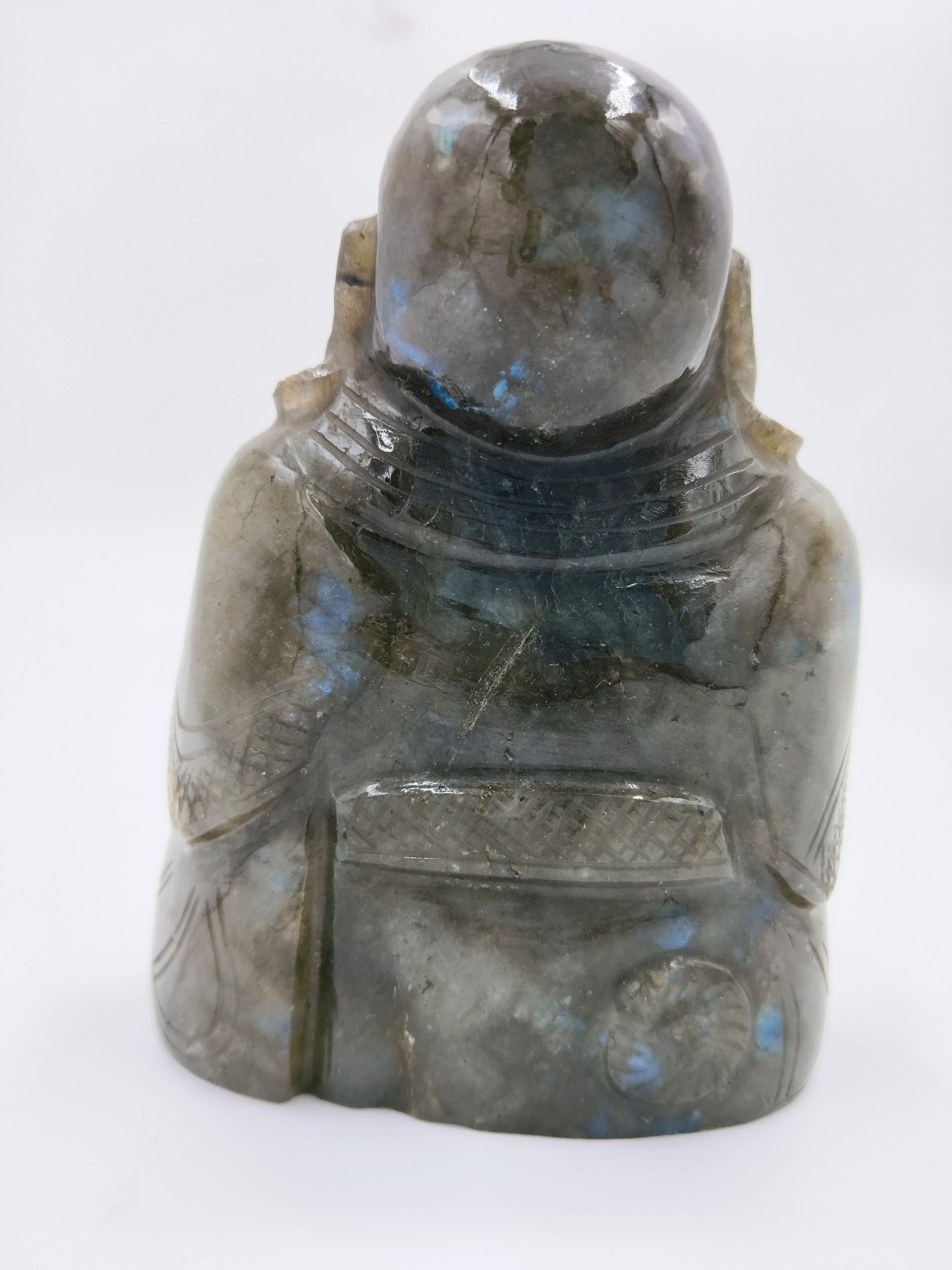 Back view of labradorite Laughing Buddha sculpture with carved details