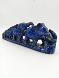 Blue lapis elephant group sculpture with five elephants on a base, side view