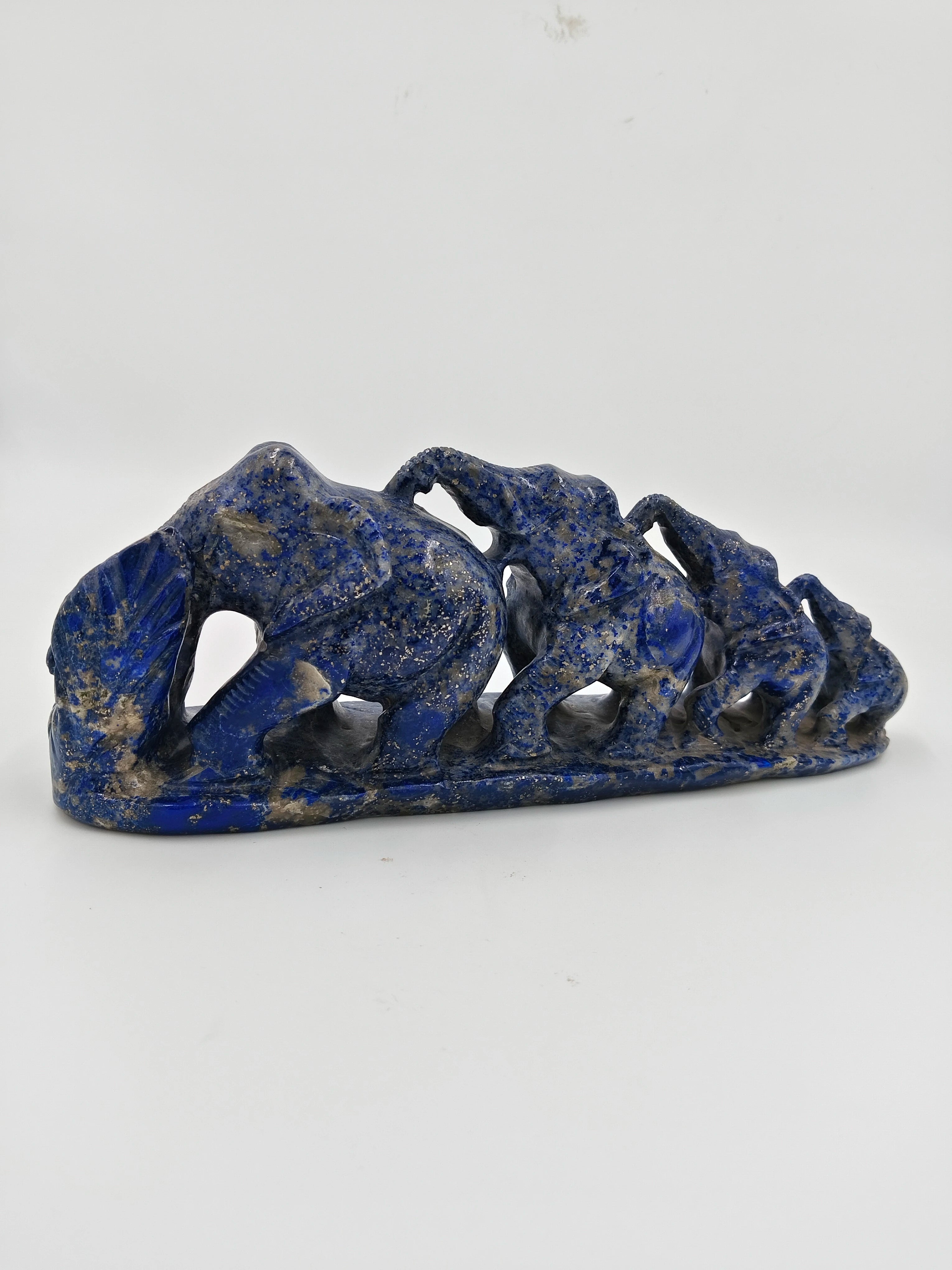 Lapis stone sculpture of a group of elephants in a row