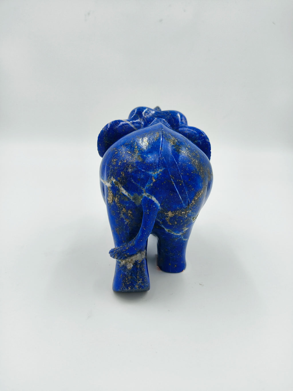 Back view of a small lapis lazuli elephant figurine sculpture