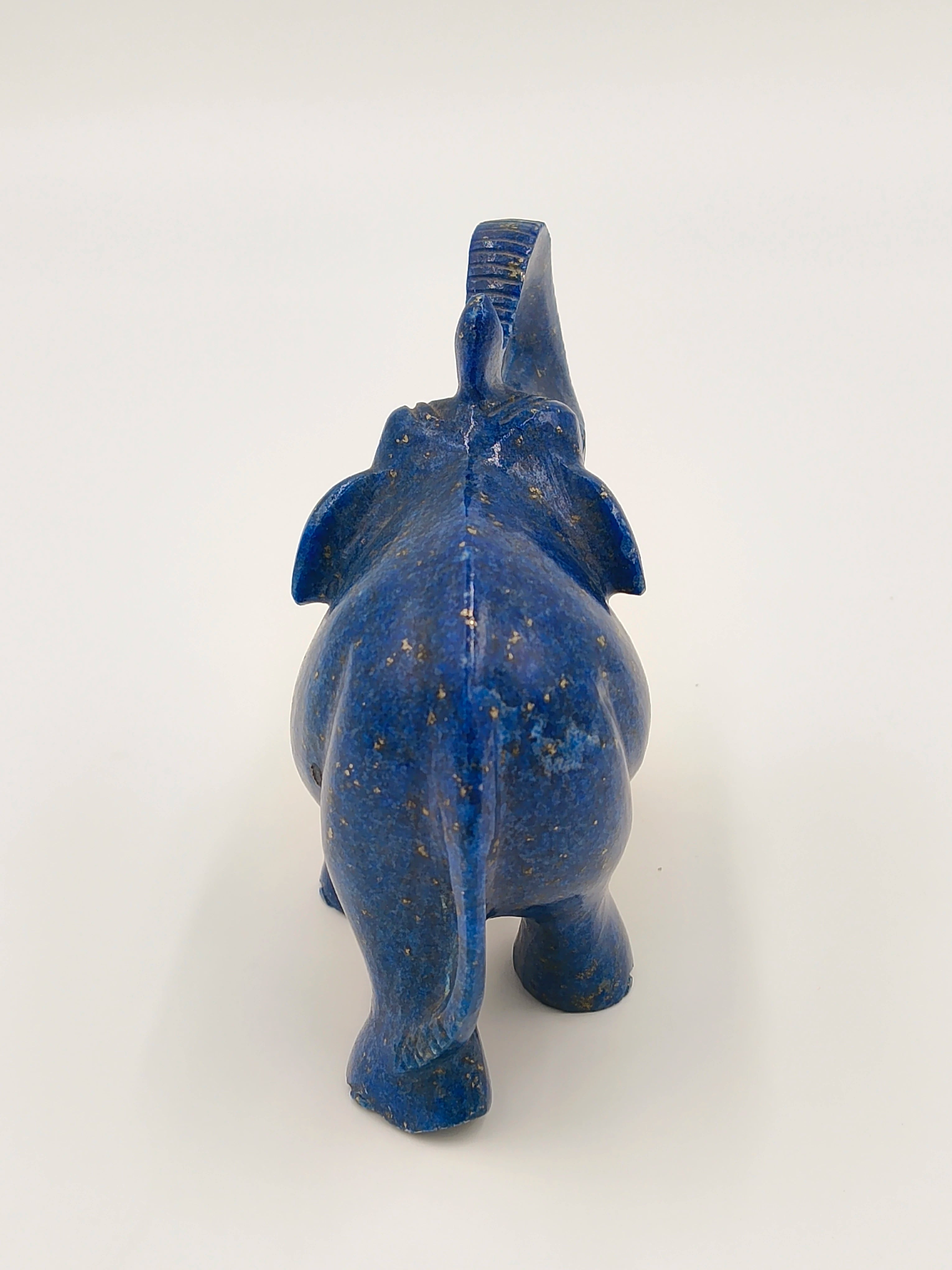 Back view of small lapis blue elephant figurine sculpture