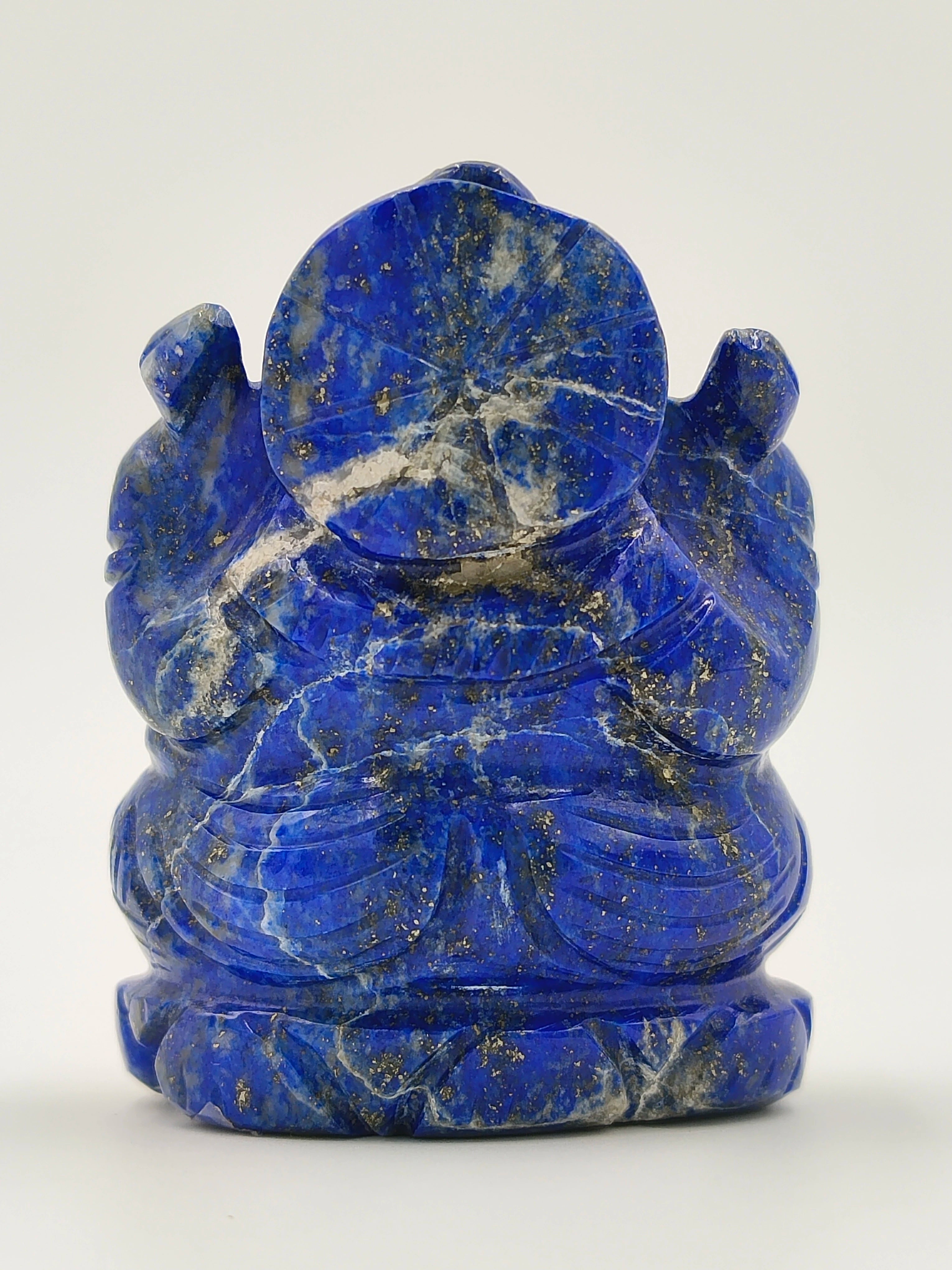 Back view of a small lapis lazuli Ganesh sculpture with intricate details