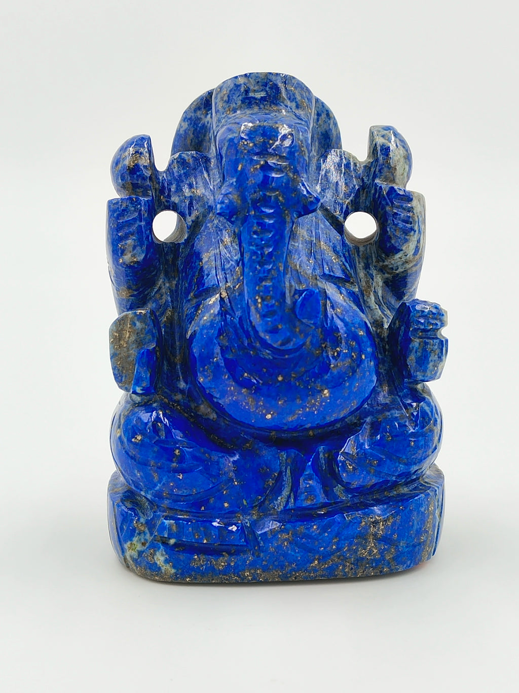 Small lapis lazuli sculpture of seated Ganesh deity with intricate detailing
