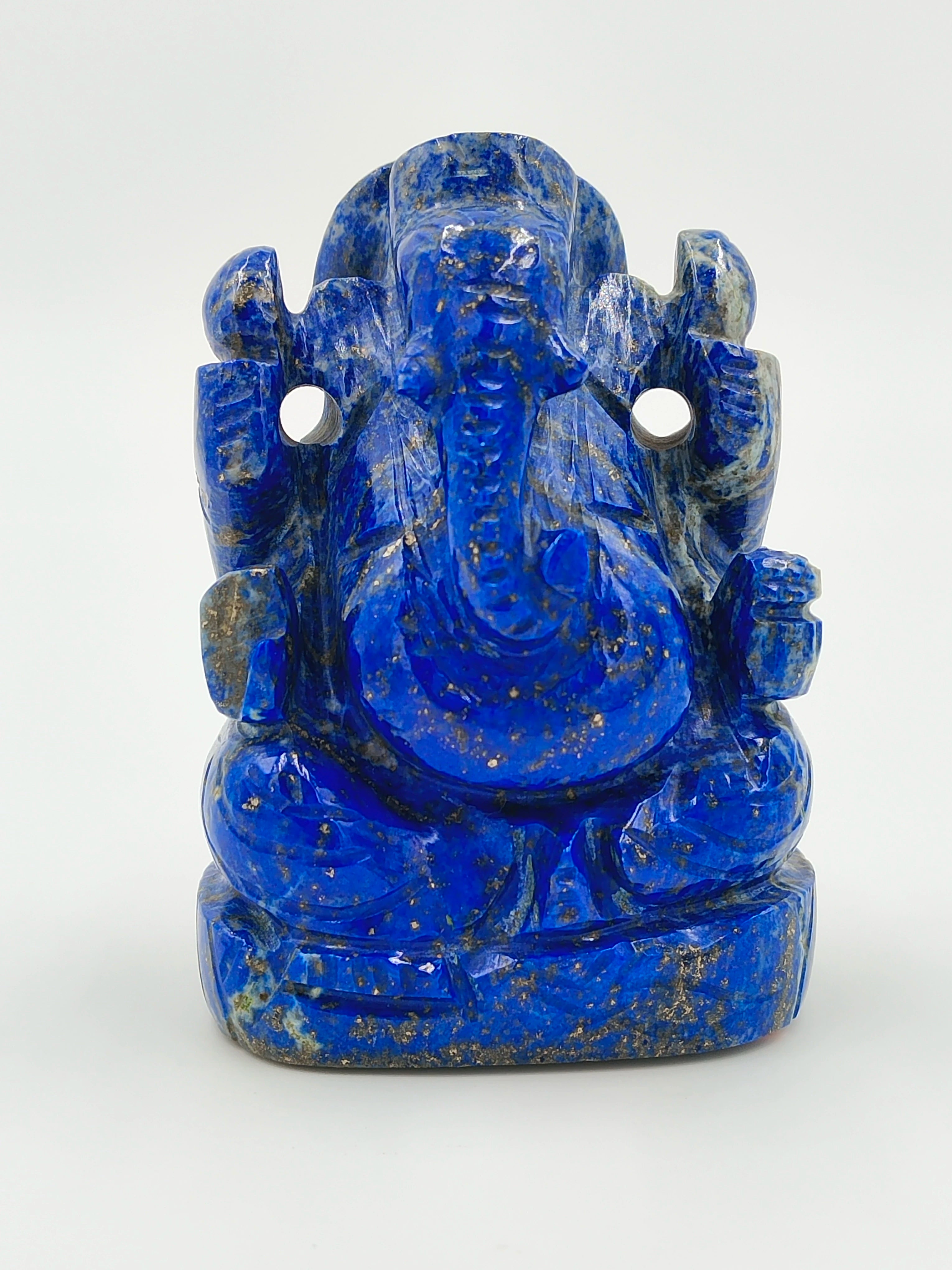 Small lapis lazuli sculpture of seated Ganesh deity with intricate detailing