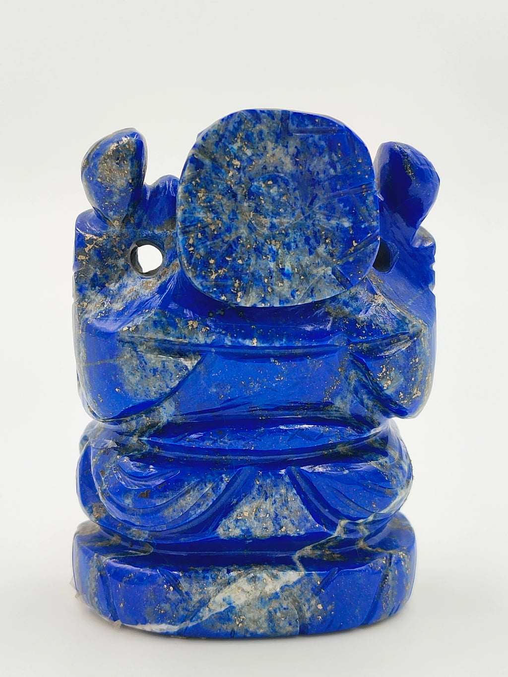 Back view of small blue lapis Ganesh idol sculpture with detailed carvings