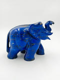 Small lapis elephant sculpture with raised trunk and carved details