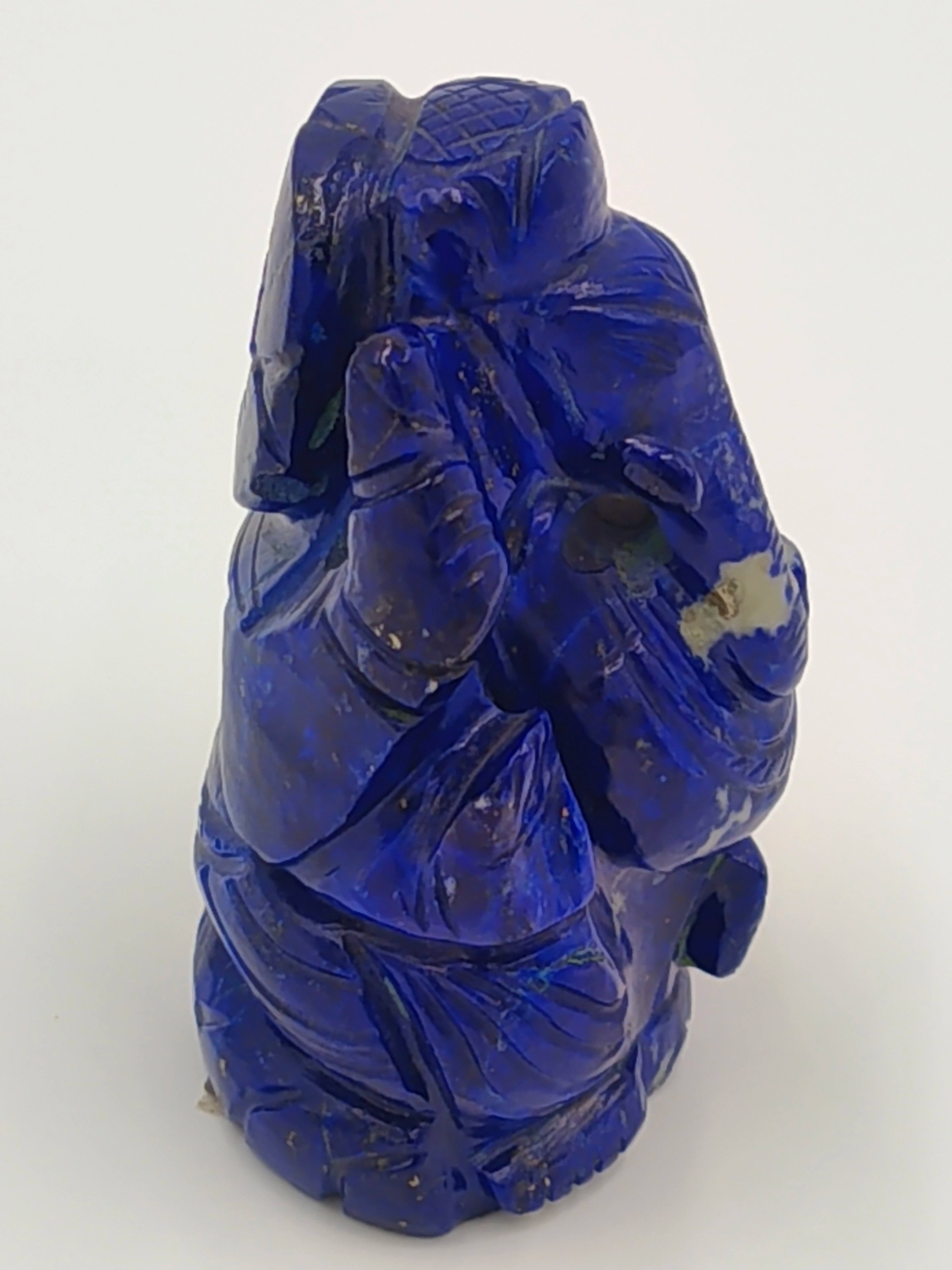 Small carved Ganesh statue made of blue lapis stone, front view
