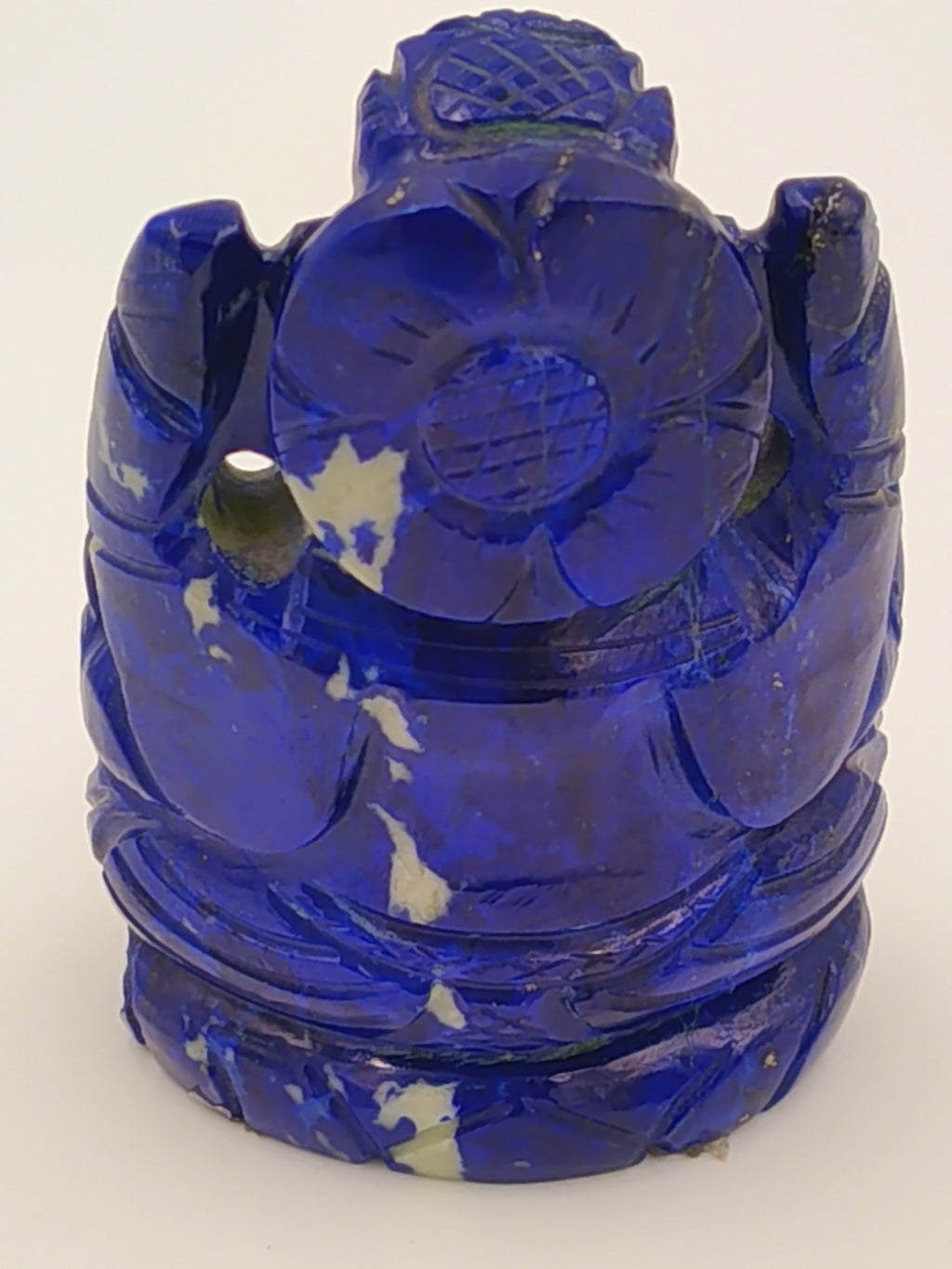 Back view of a 1.9 inch lapis lazuli Ganesh sculpture with intricate carvings