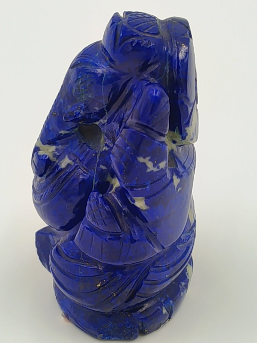 Blue lapis stone sculpture of deity Ganesh in a compact form