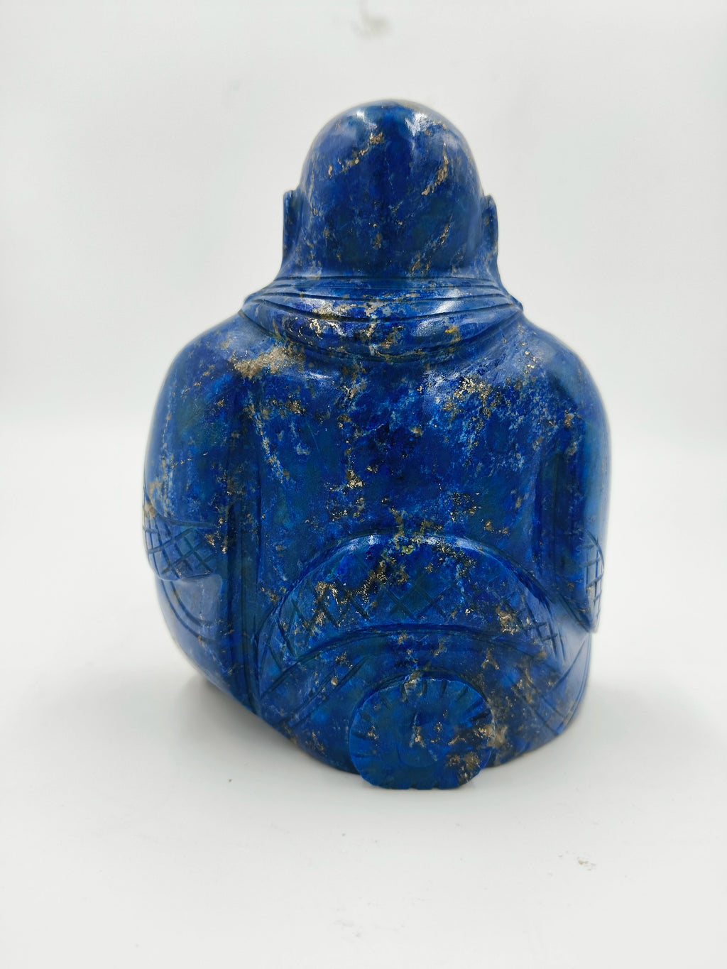 Back view of lapis lazuli Laughing Buddha sculpture with detailed carvings