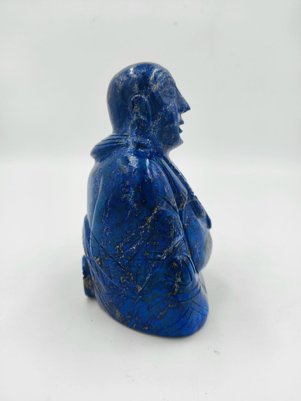 Side view of 4.3-inch Laughing Buddha sculpture carved from lapis lazuli