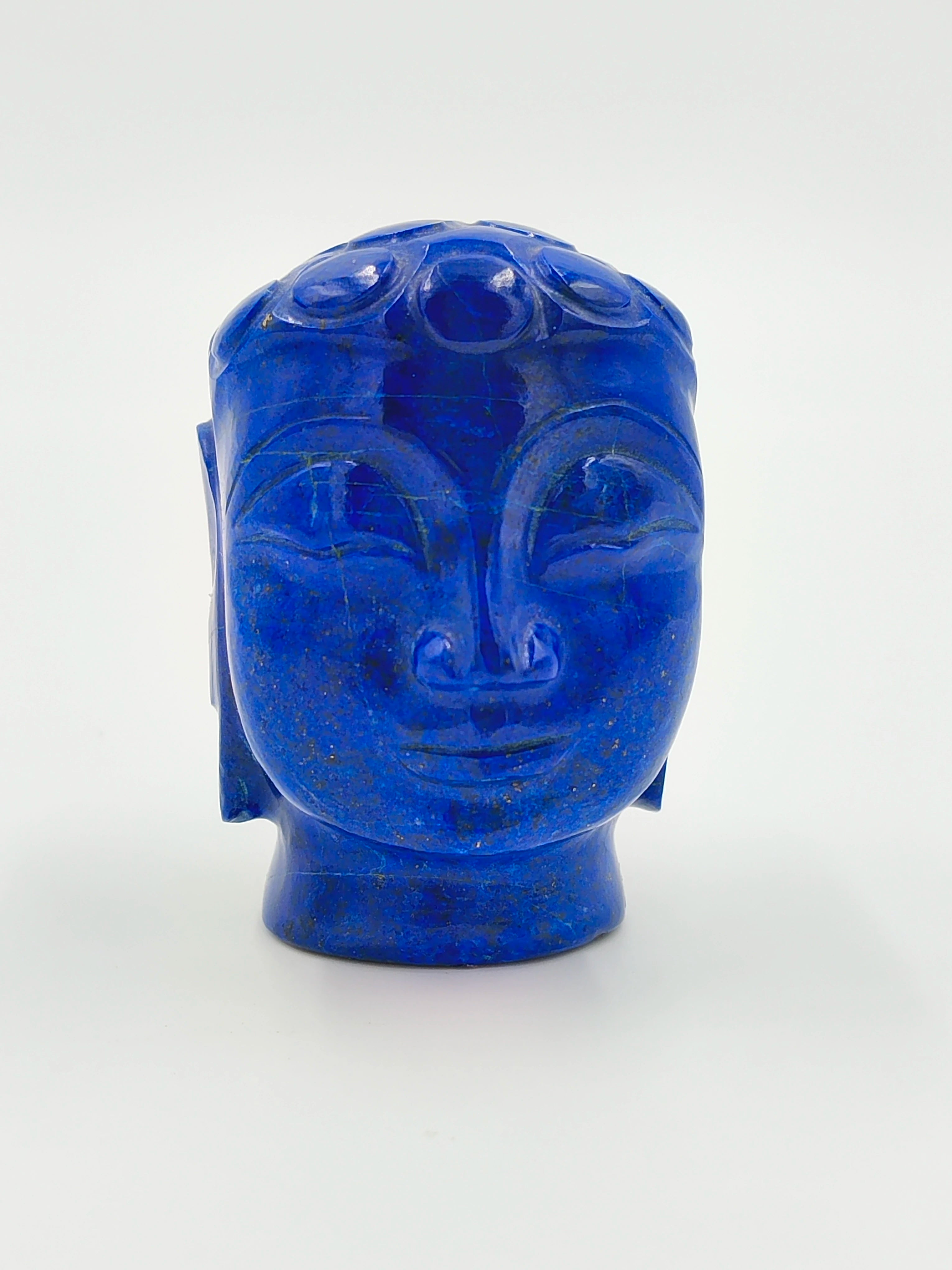 Front view of a 1.9 inch blue lapis lazuli Buddha head idol sculpture