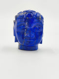 Miniature Buddha head sculpture carved from blue lapis stone, front view